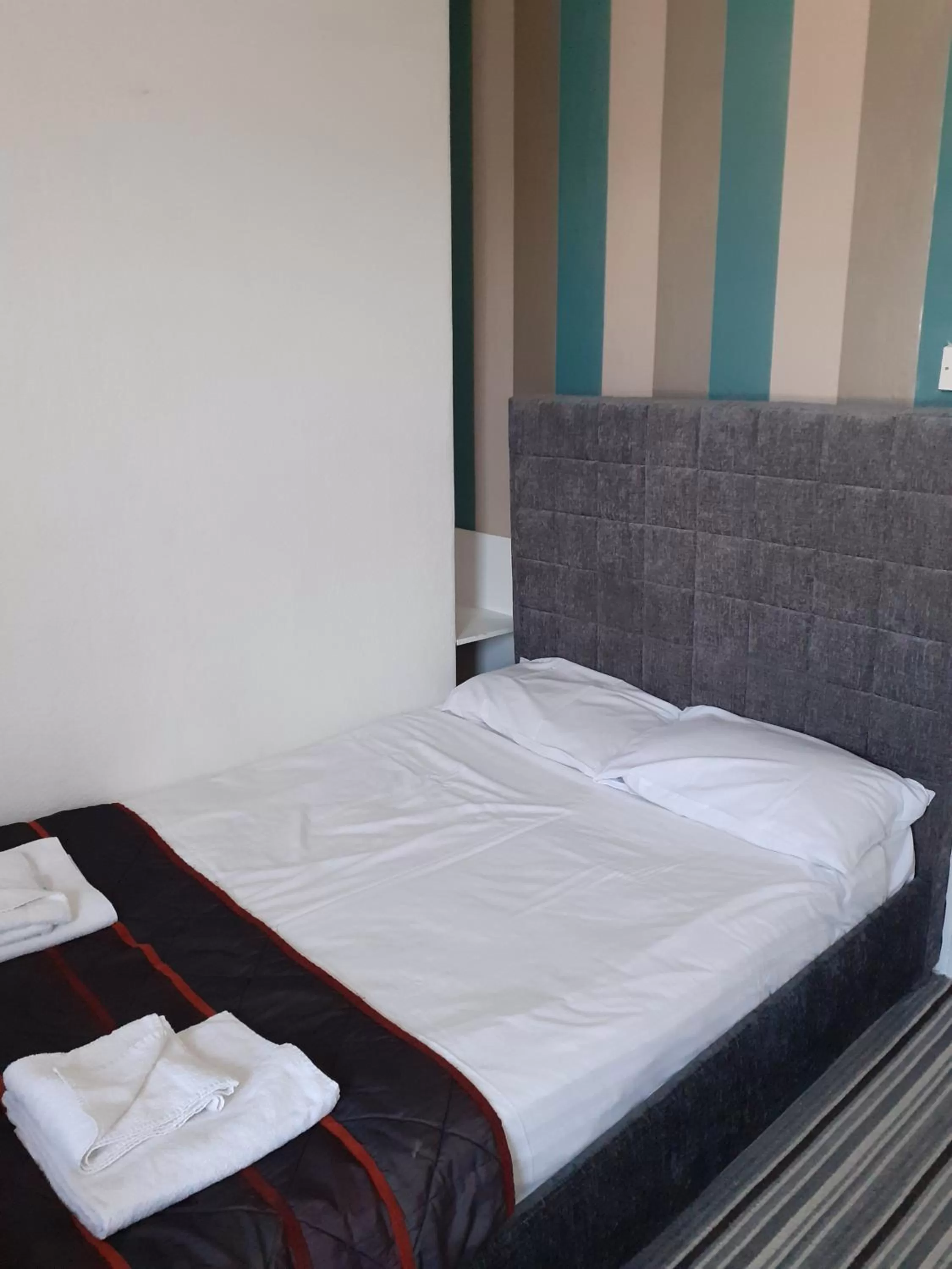 Bed in The Coastal Bay Hotel