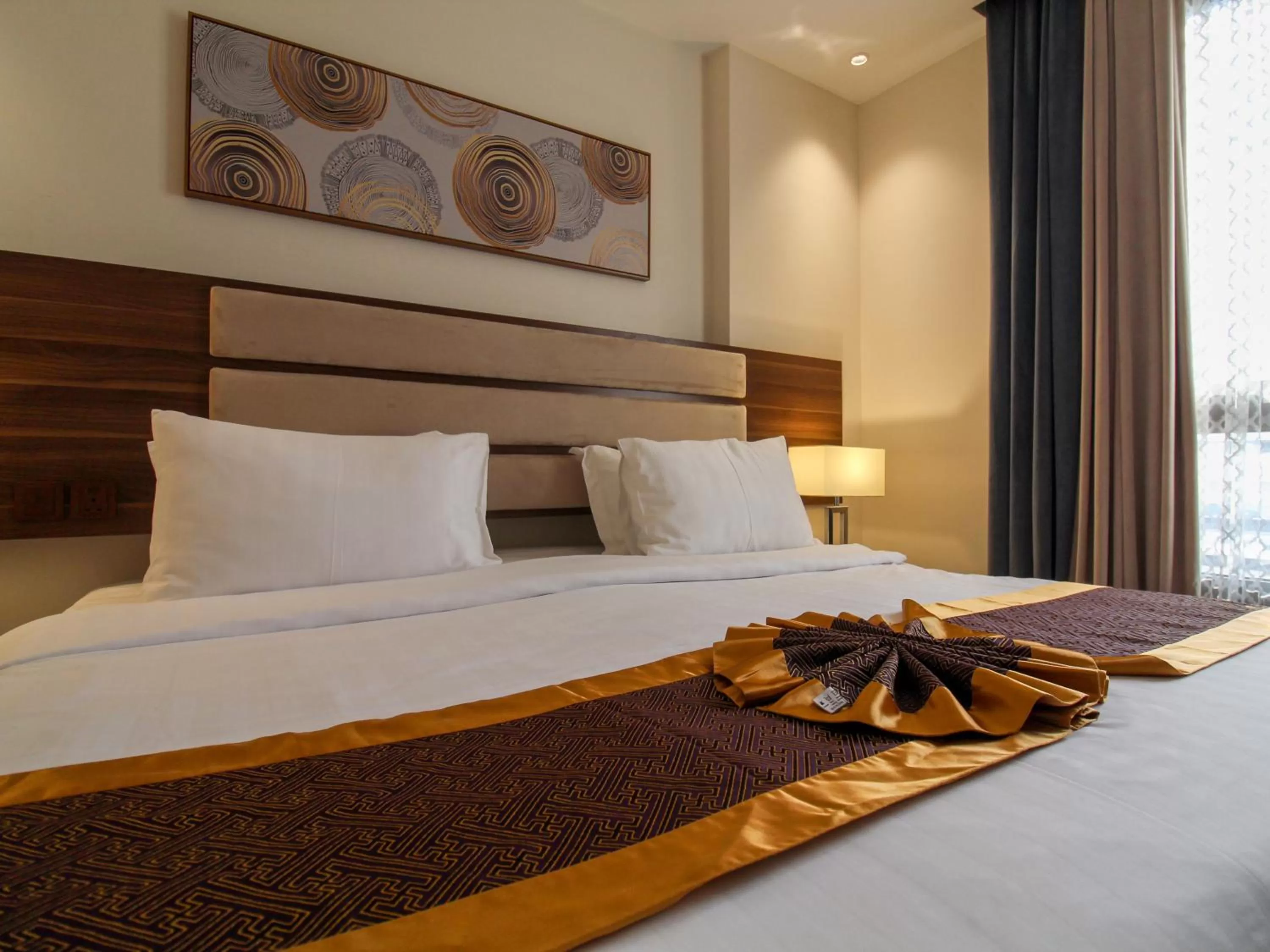 Bed in Friesian Hotel Suites