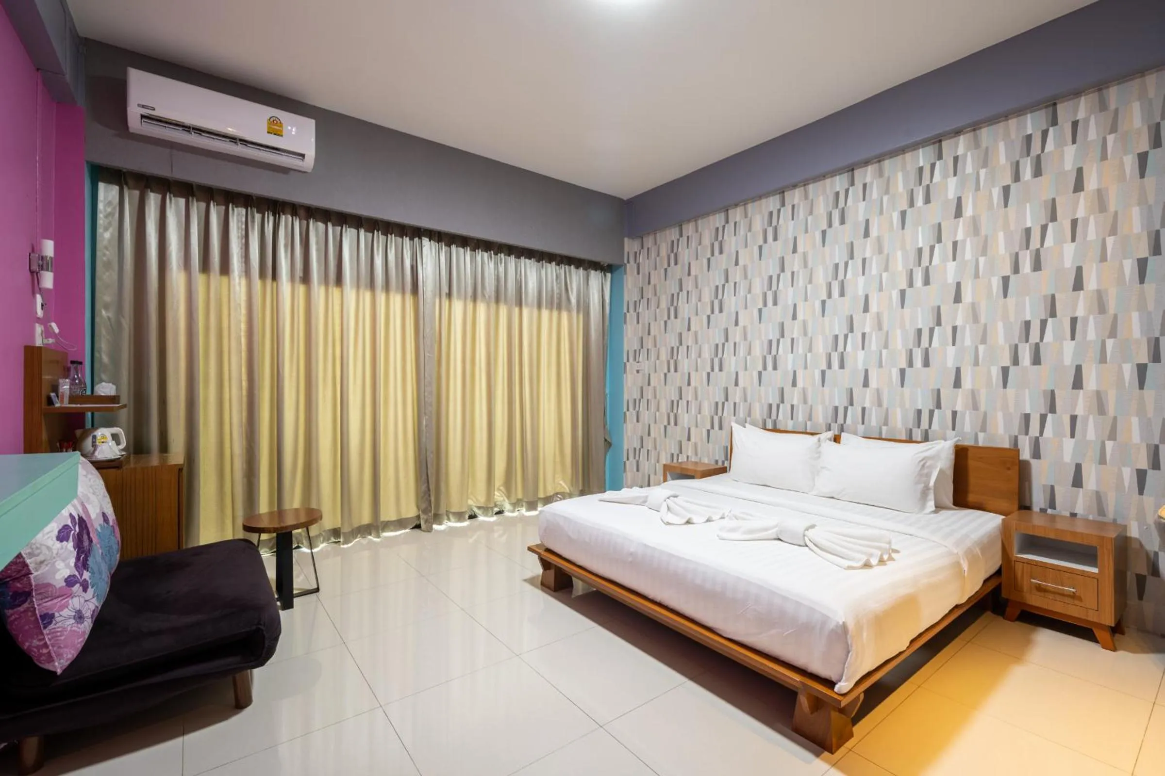 Bed in The Iconic Hotel Ranong