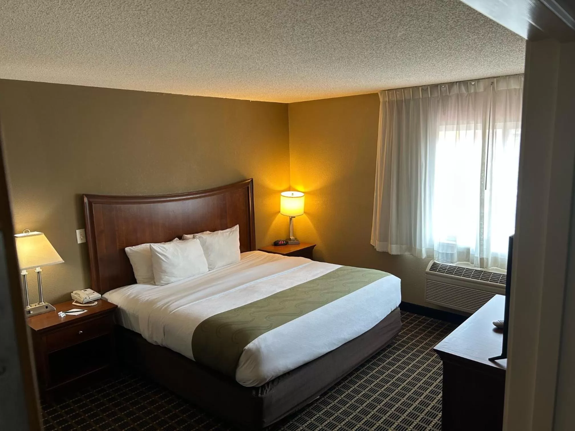 Bed in Quality Inn & Suites