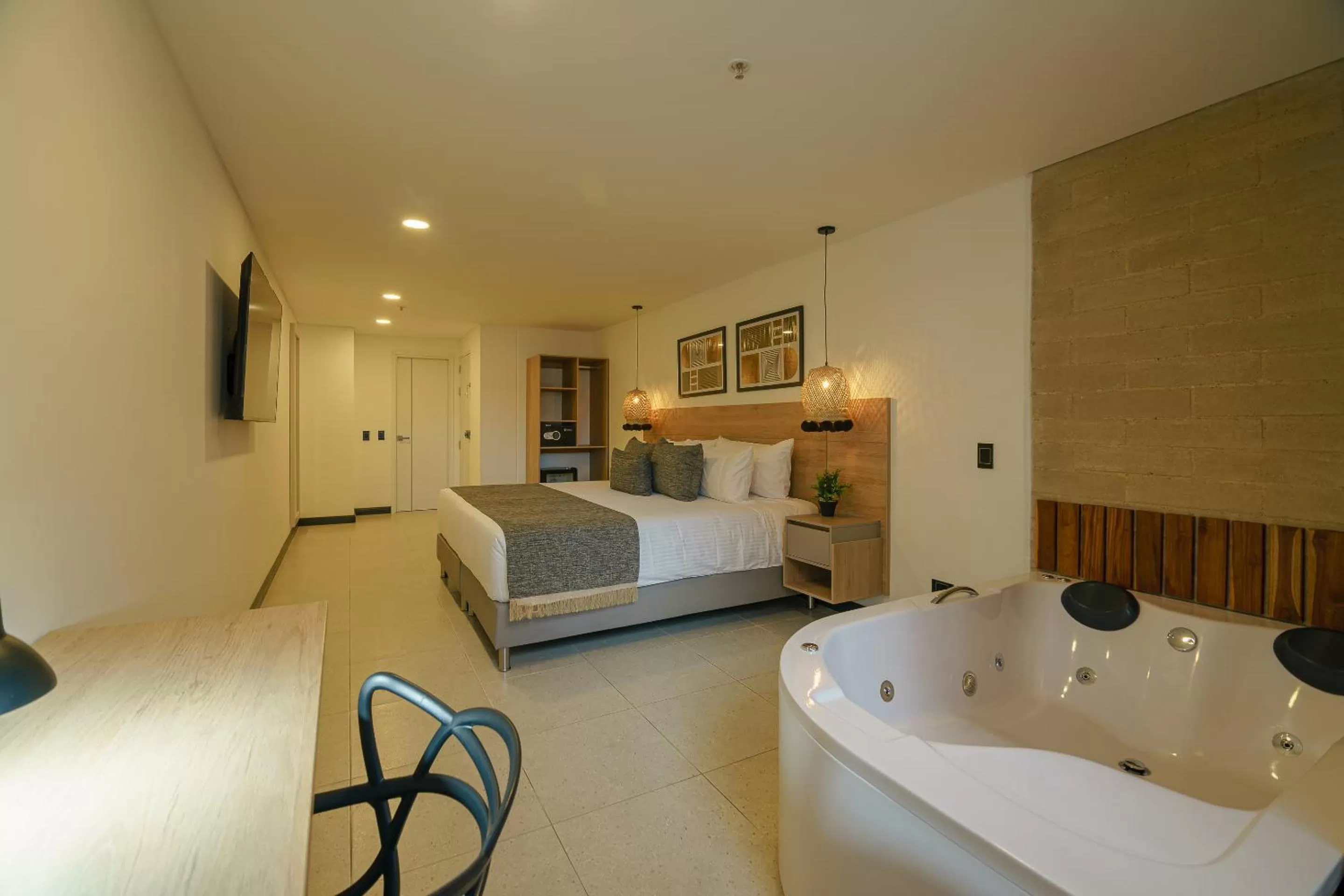 Photo of the whole room, Bed in First Class Hotel