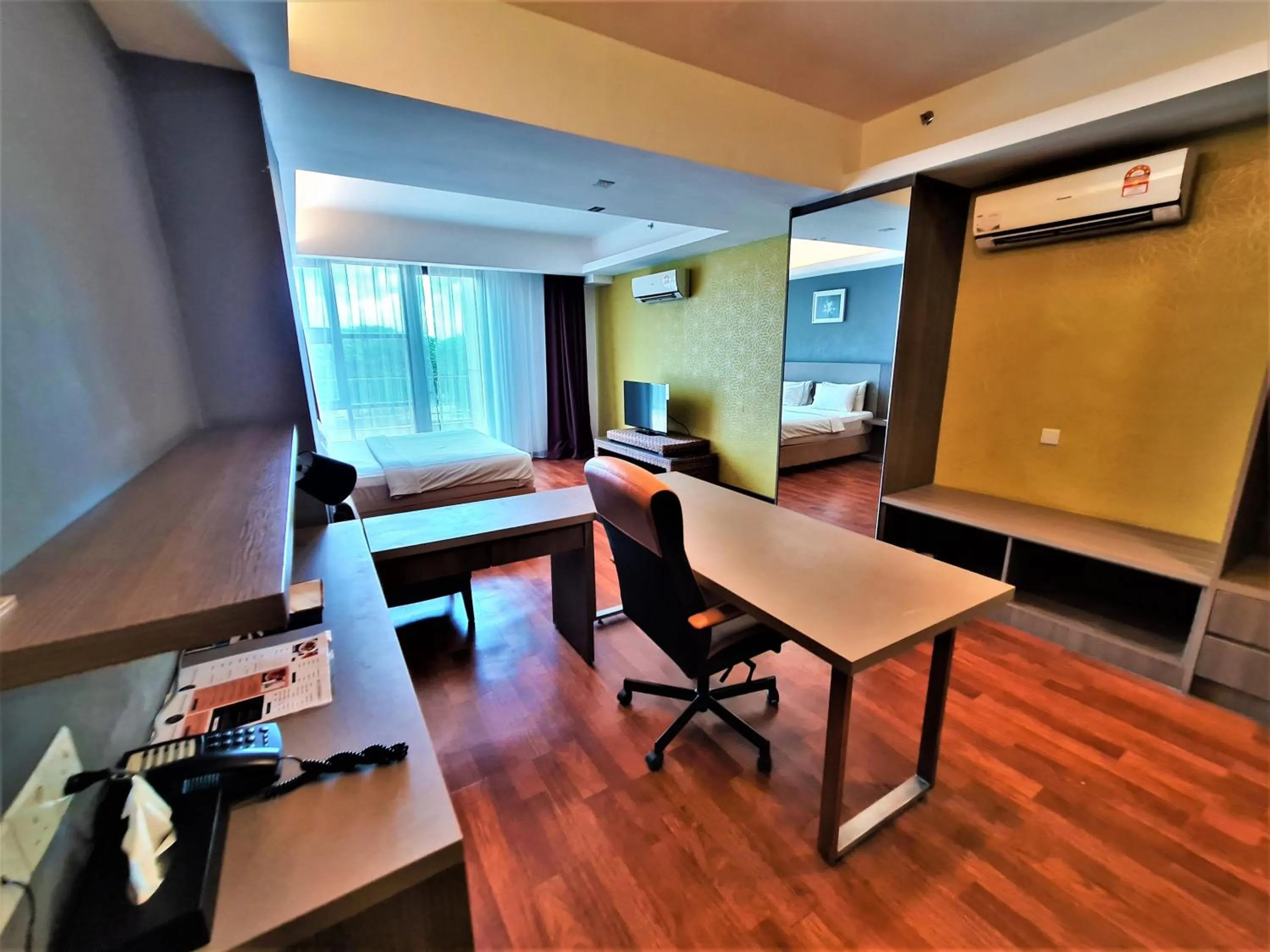 Bed in Nexus Regency Suites & Hotel