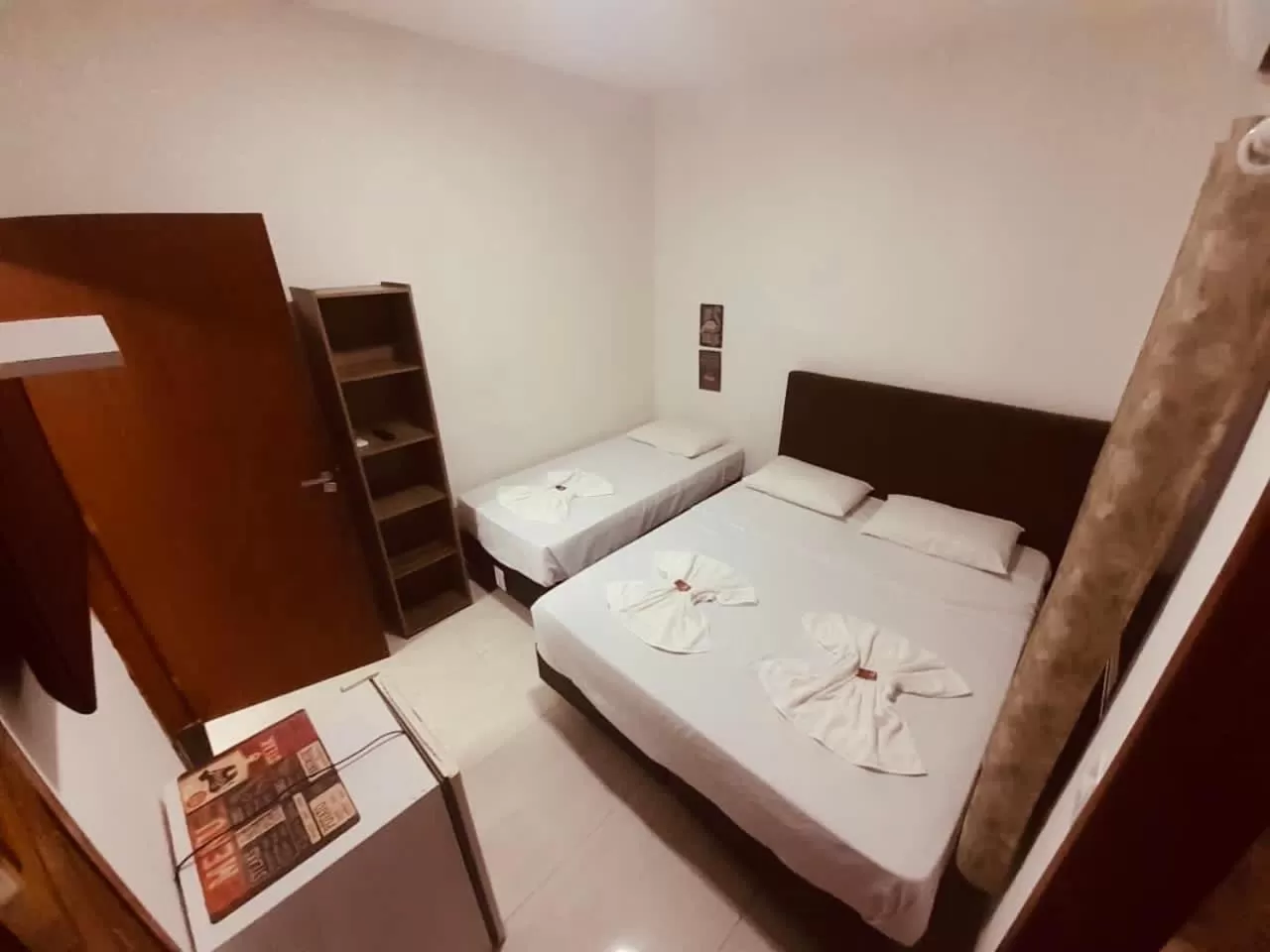 Bed in Flamingo Beach Pousada