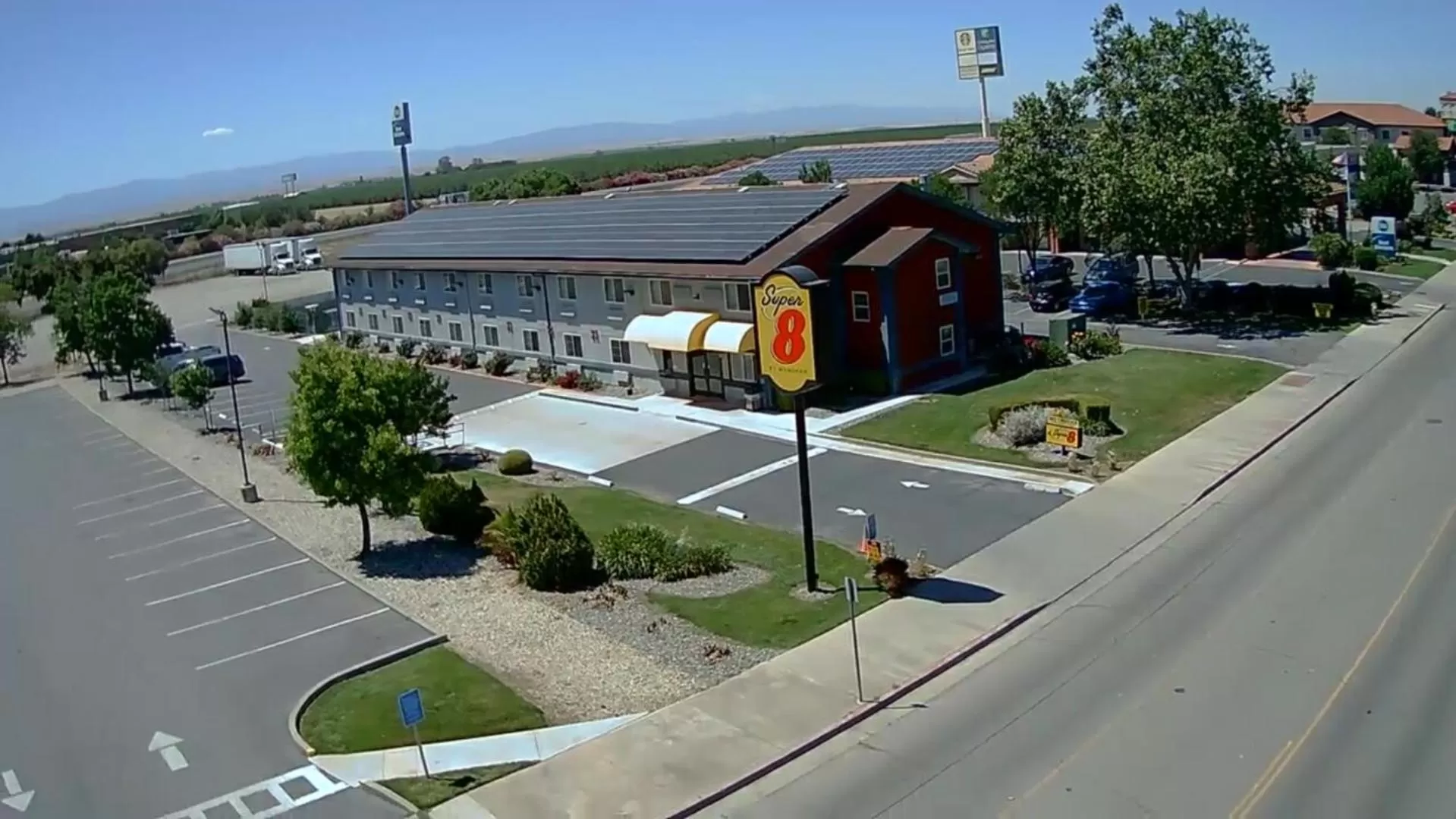 Property logo or sign in Super 8 by Wyndham Willows