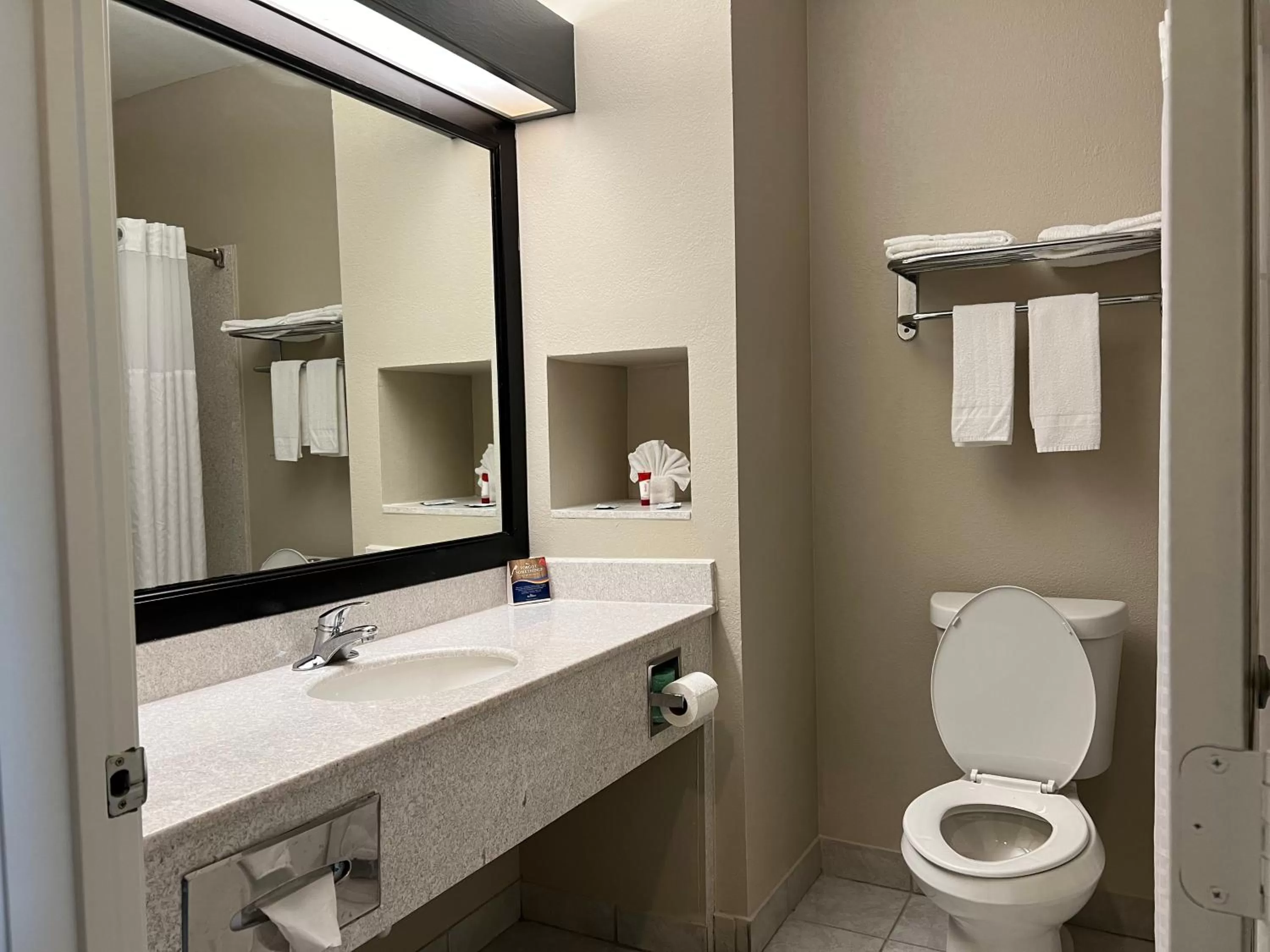 Bathroom in Baymont by Wyndham Houston Brookhollow