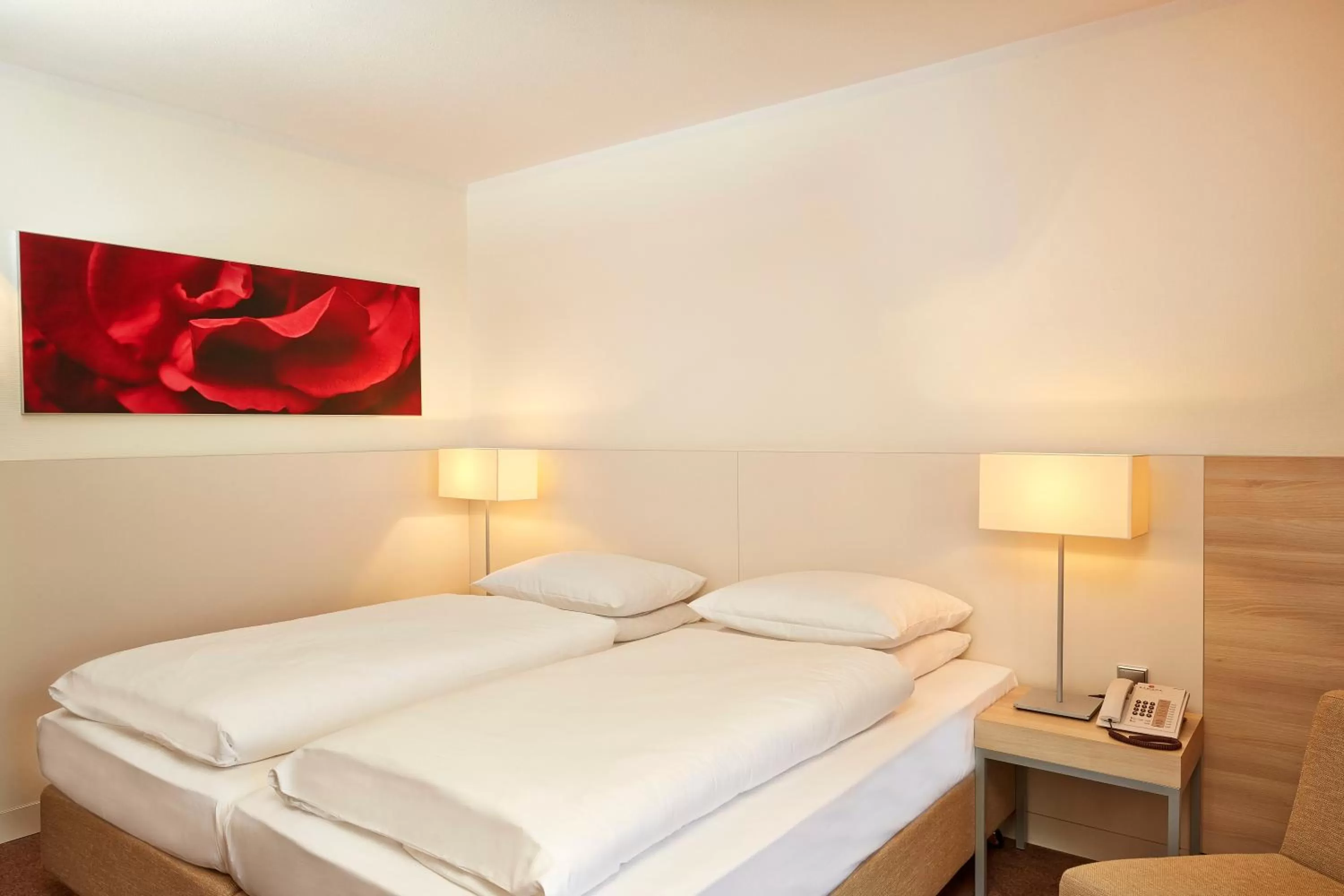 Bedroom, Bed in H+ Hotel Bad Soden