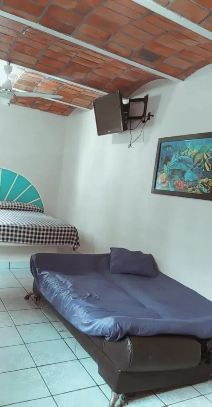 Bed in Bungalows Casa Regina