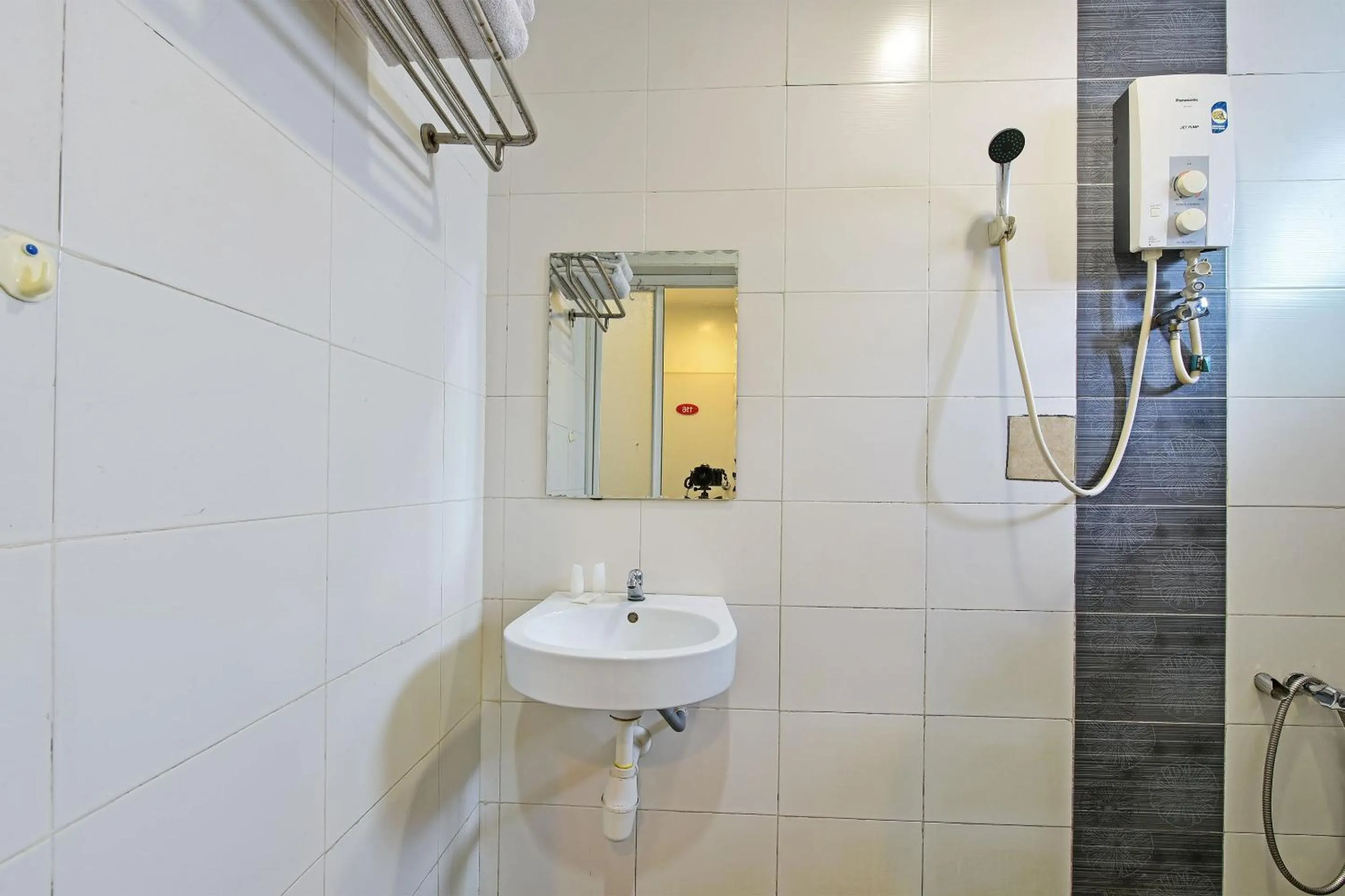 Bathroom in OYO 90853 New Soho Hotel