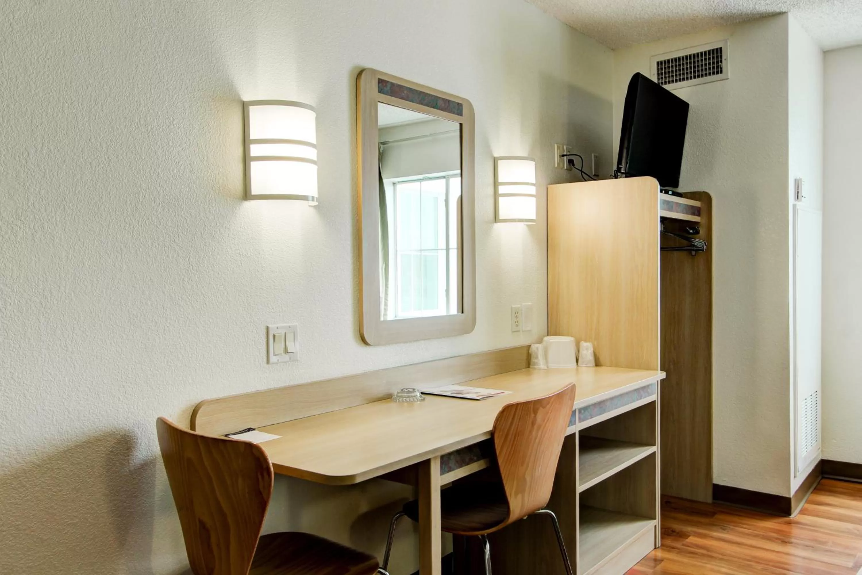 Seating area in Super 8 by Wyndham Aurora East