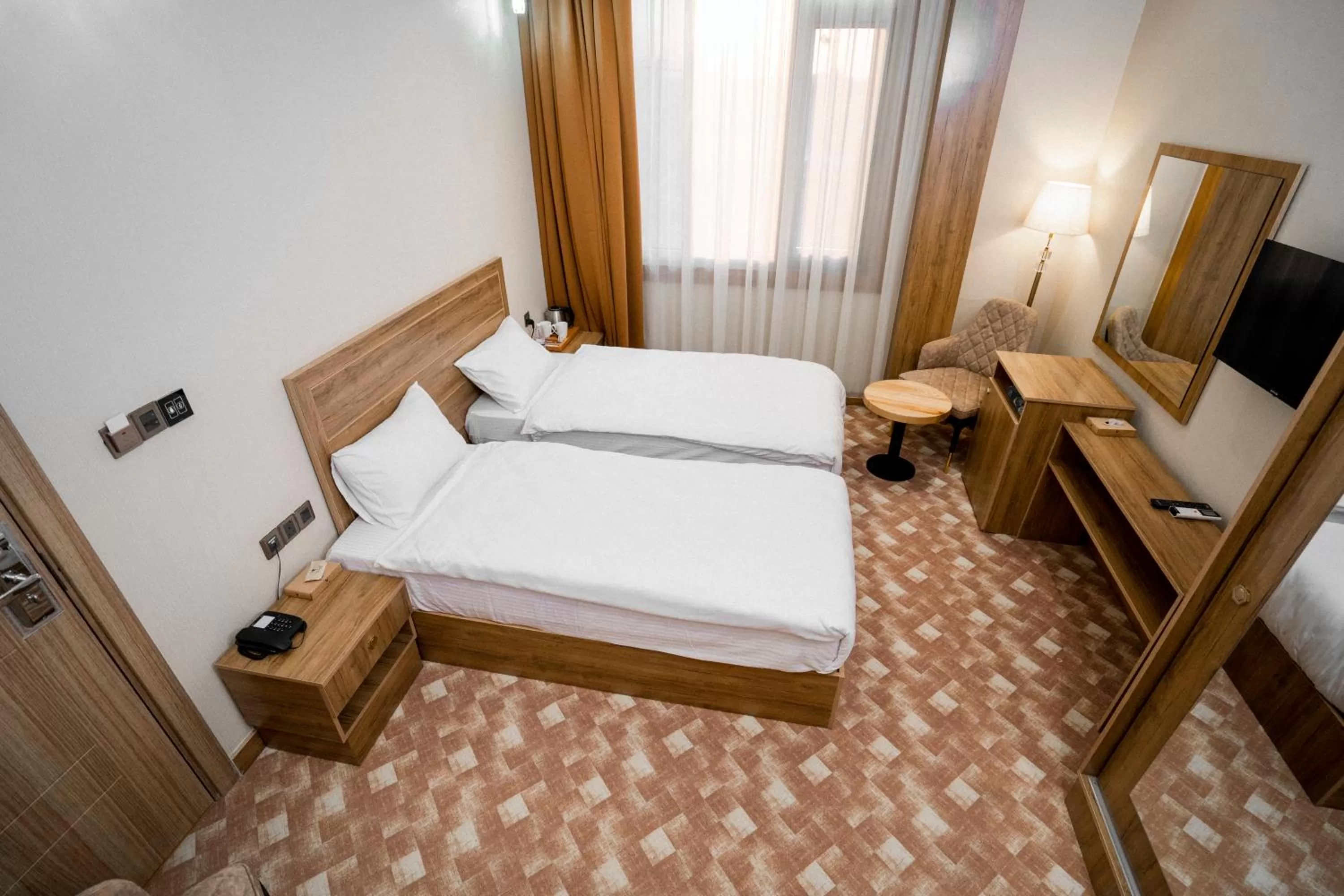 Bed in Al Yarmouk International Hotel