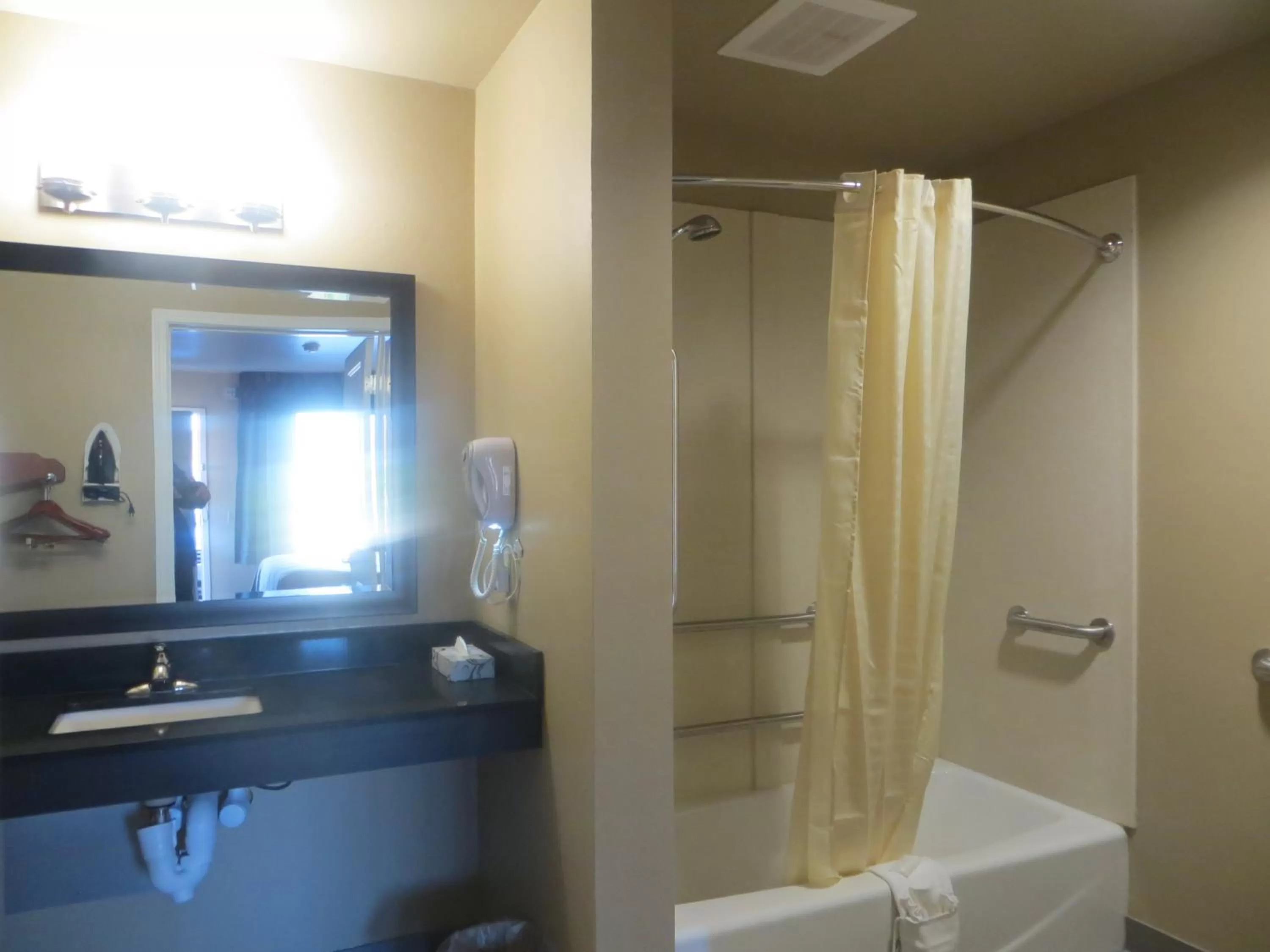 Bathroom in Garden Inn and Suites