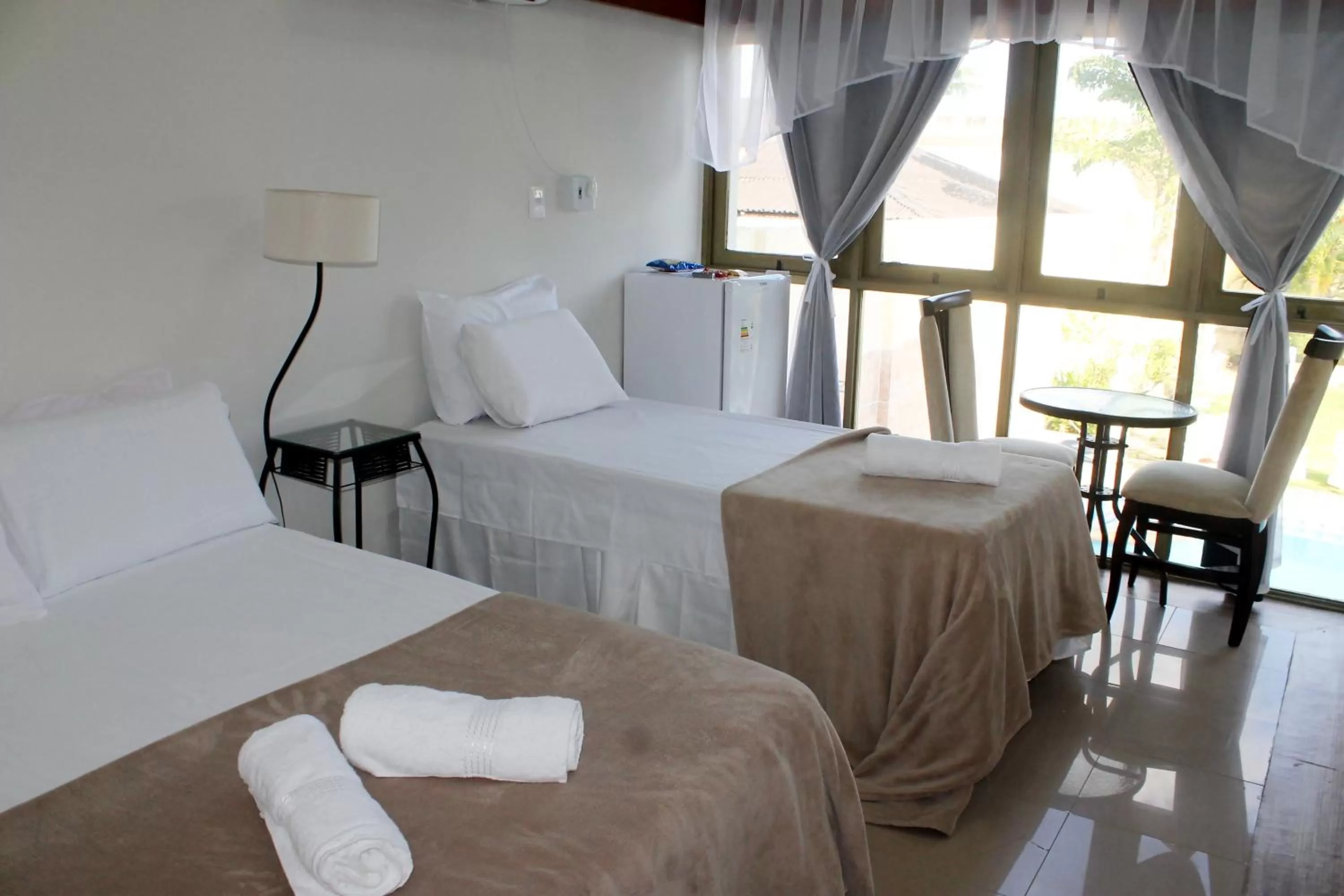 Bed in Pousada Das Palmeiras