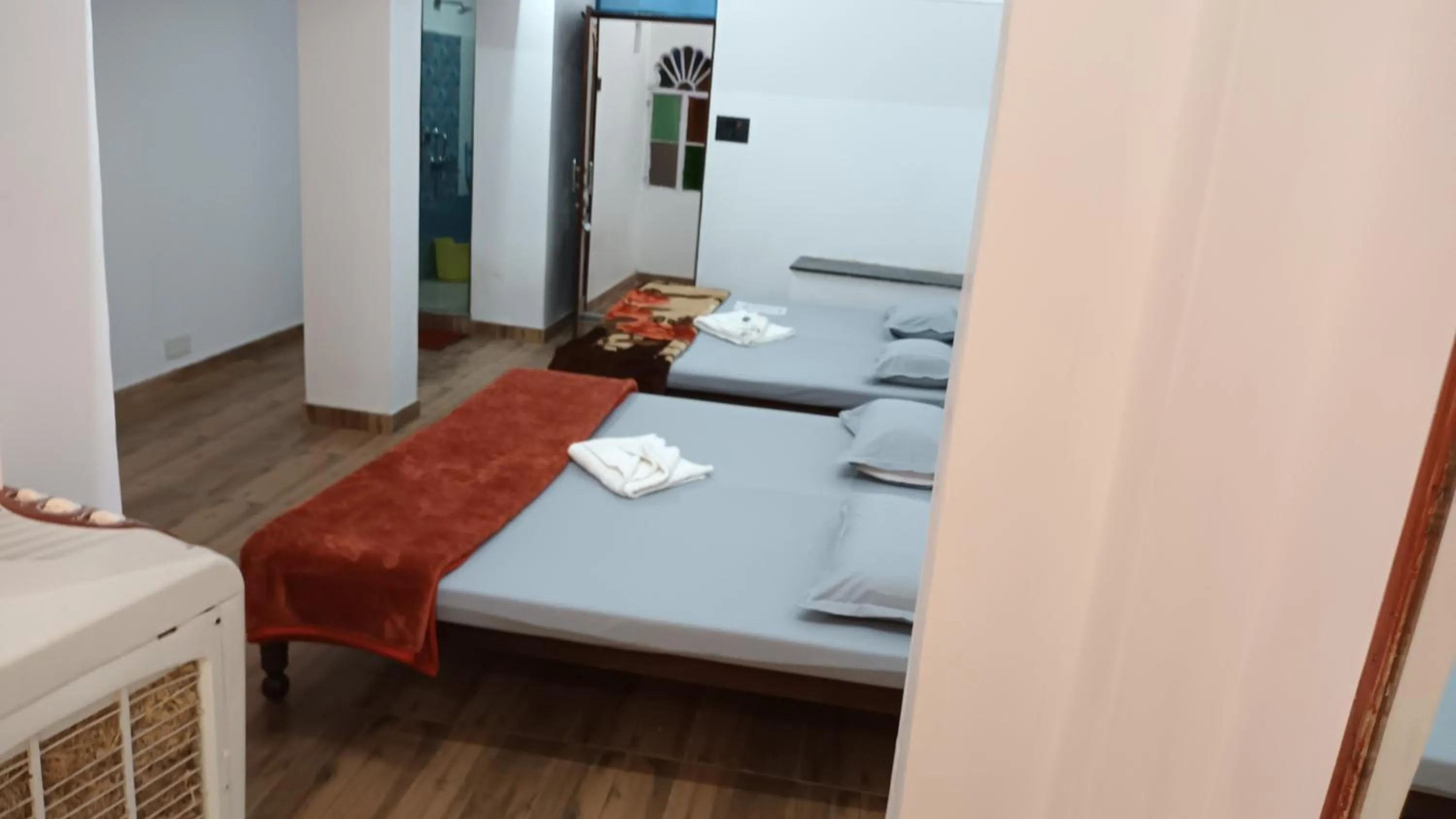 Photo of the whole room, Bed in Jag Niwas Guest House & pure veg restaurant