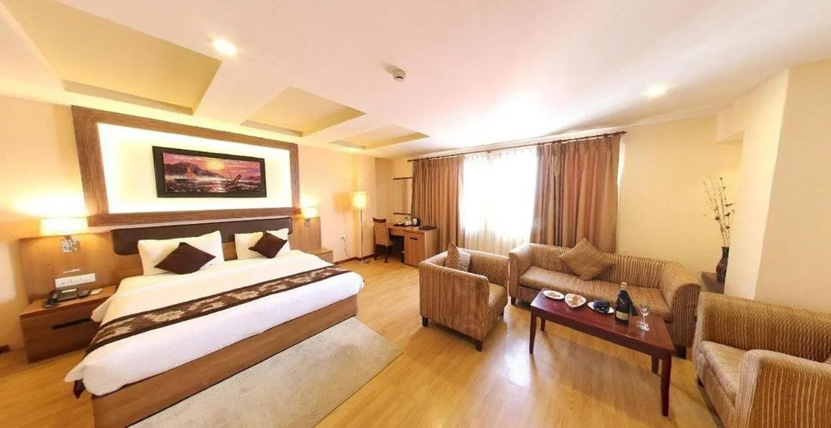 Bed in Hotel Mirage Regency