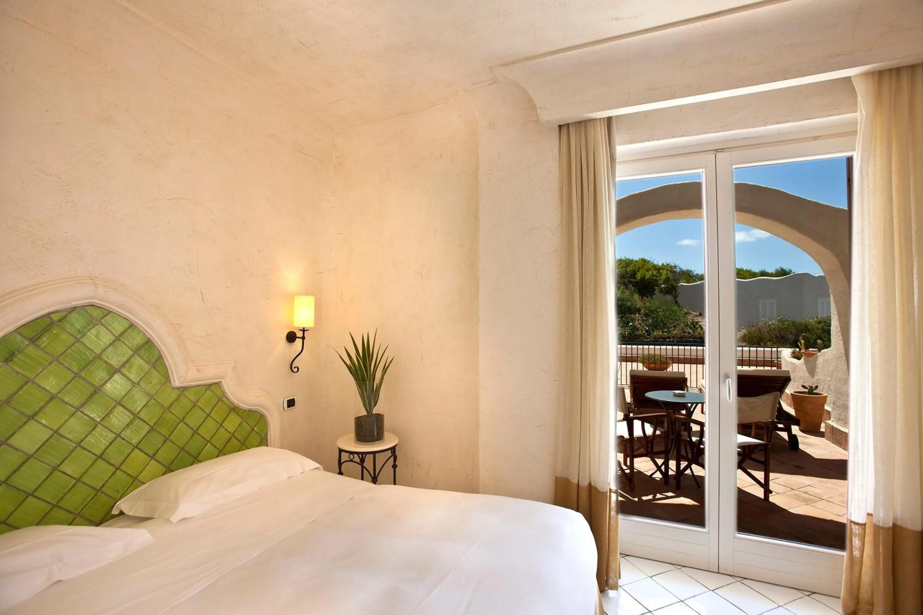 Balcony/Terrace, Bed in Therasia Resort Sea and SPA - The Leading Hotels of the World