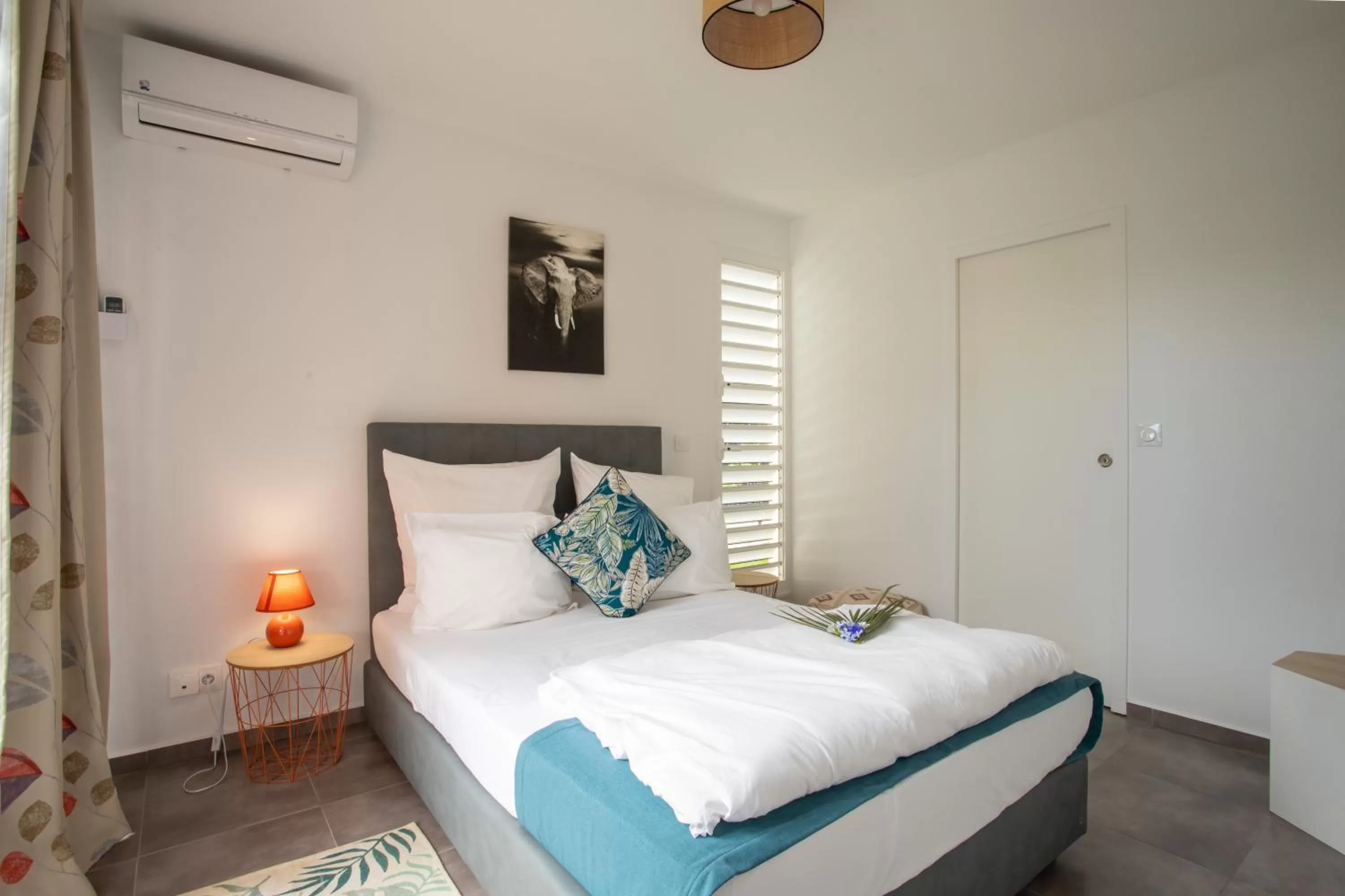 Bed in Hôtel Guadeloupe Palm Suites