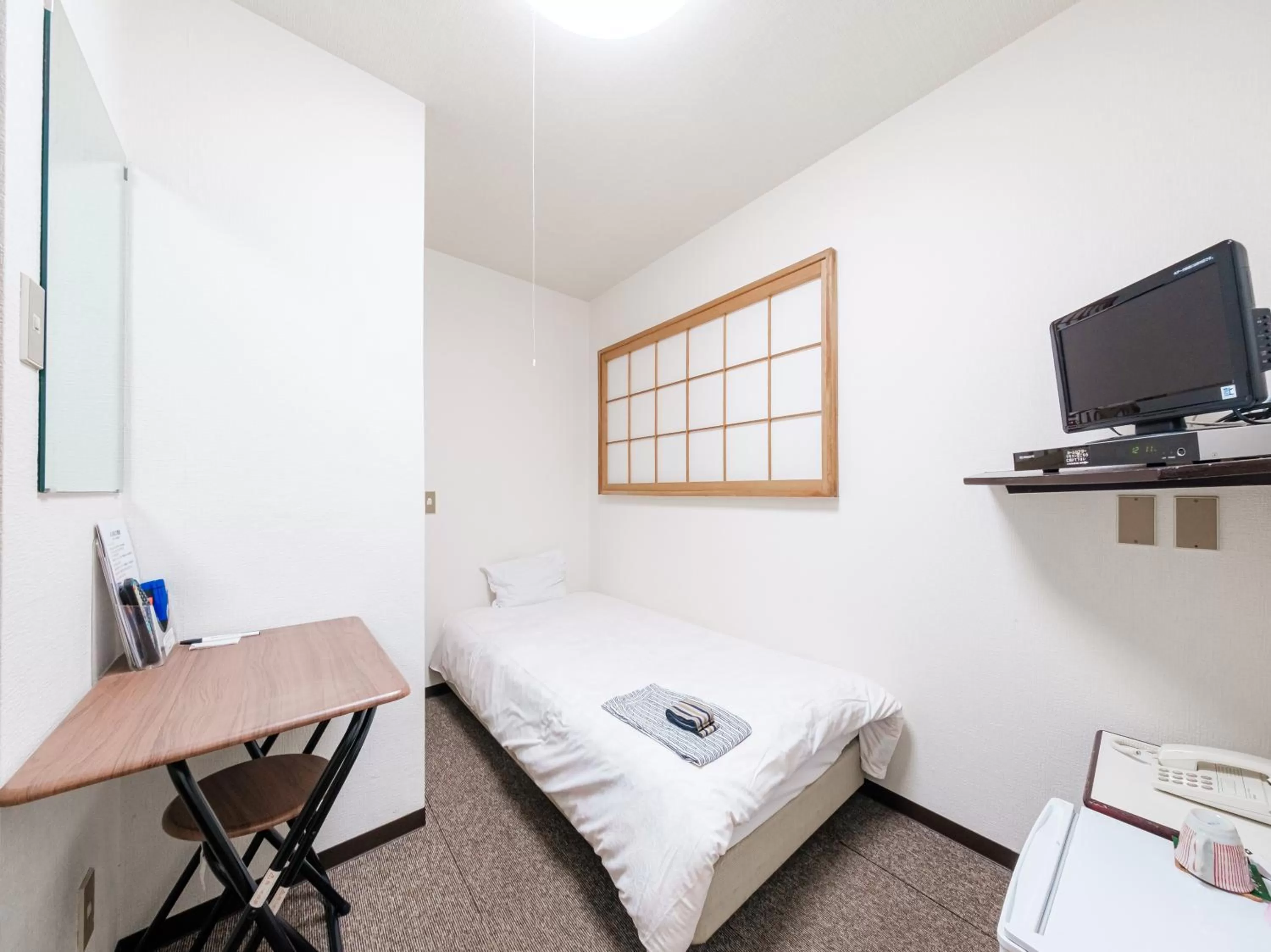 Bed in Tabist Hotel Tetora Hakodate Station