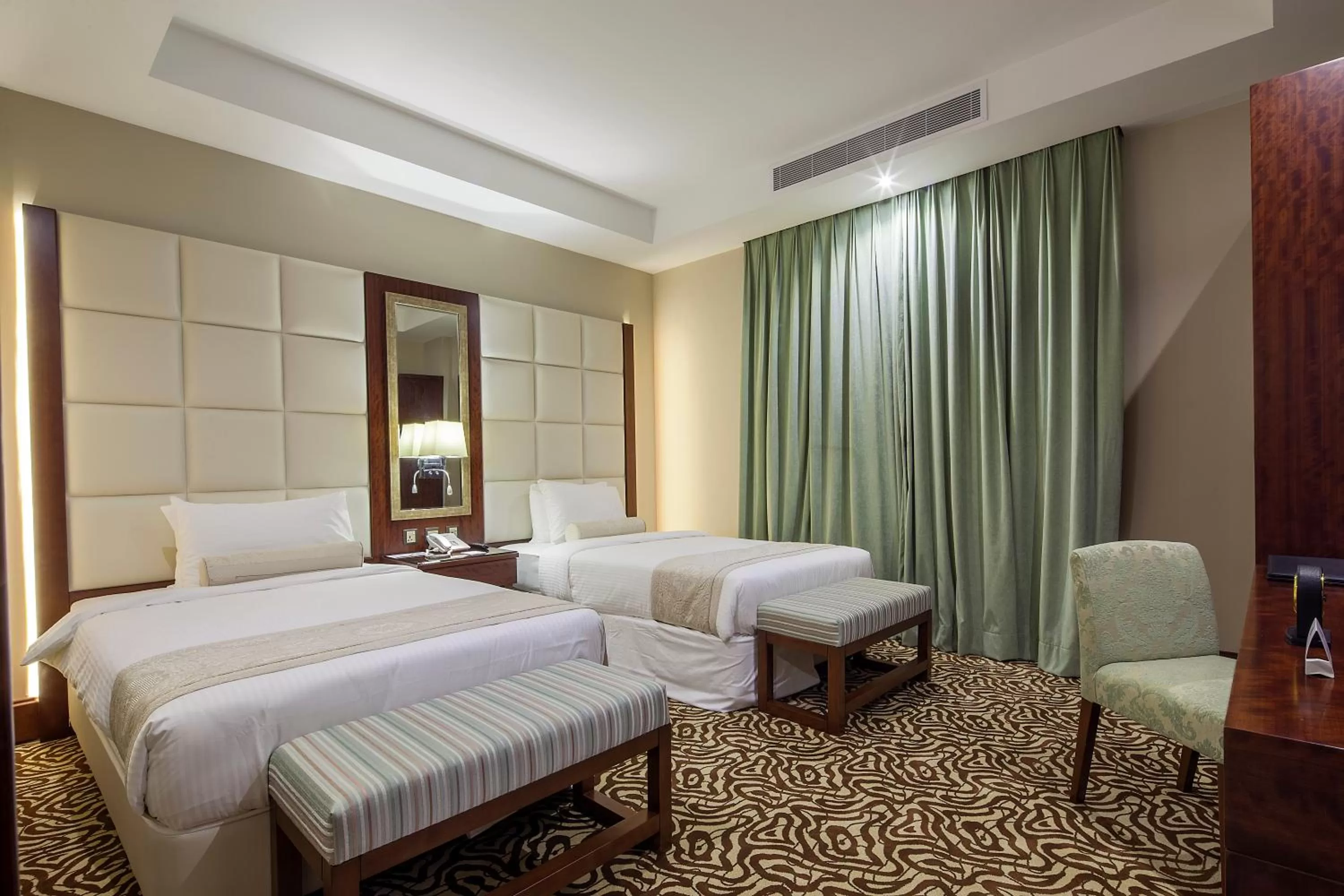 Bed in Western Lamar Hotel