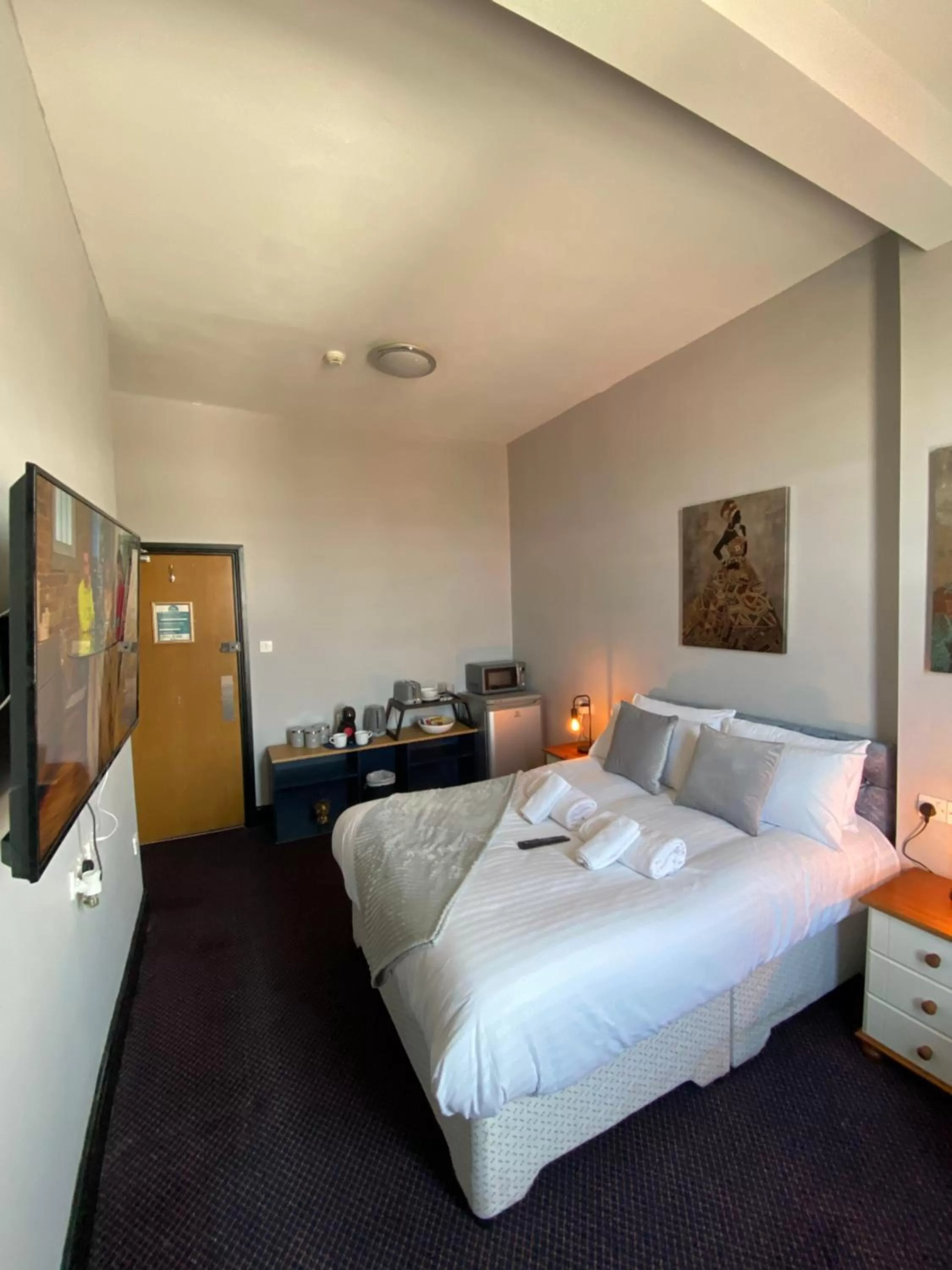 Bed in Bay view rooms at Mentone Hotel