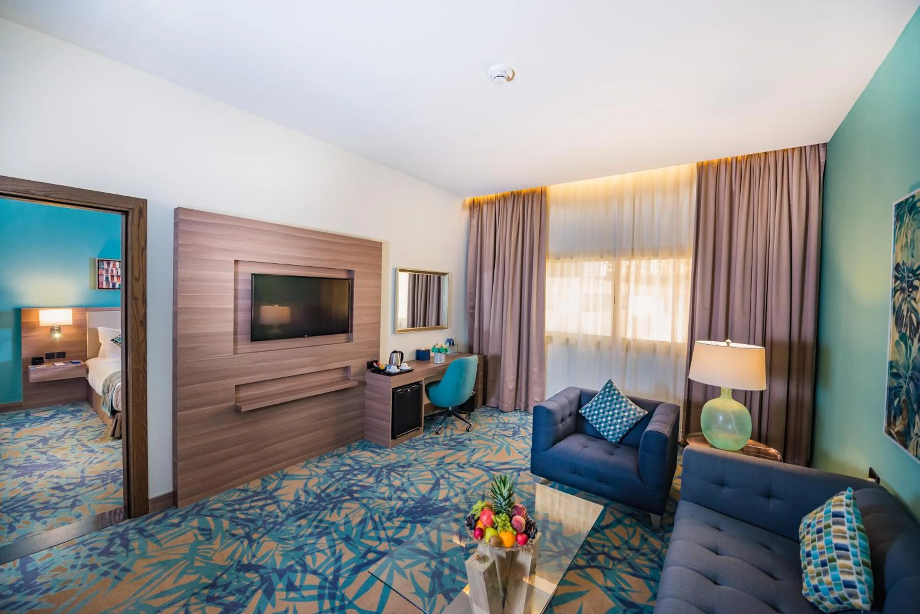 Living room, Bed in MENA Plaza Hotel Albarsha At The Mall