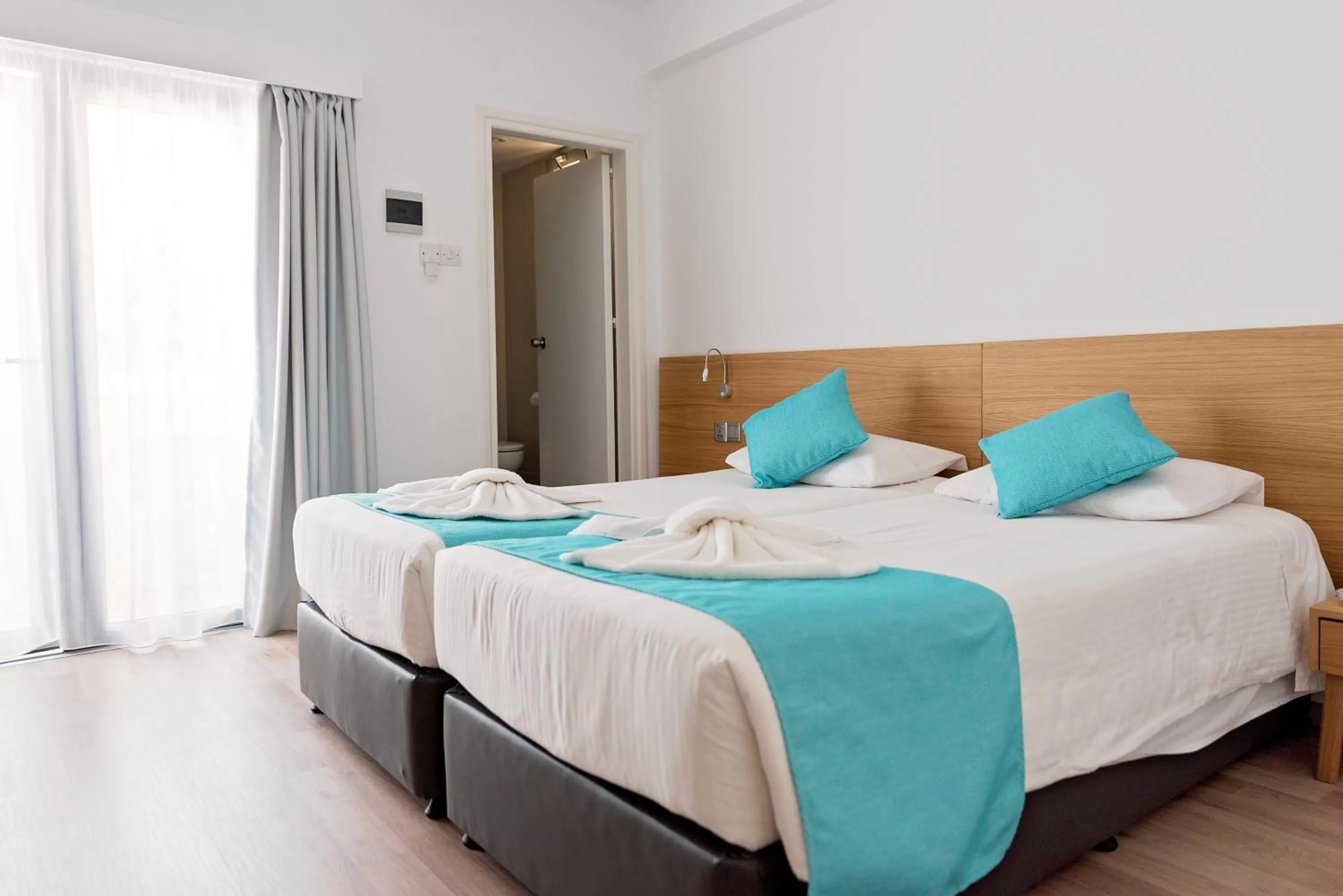 Bed in Pyramos Hotel