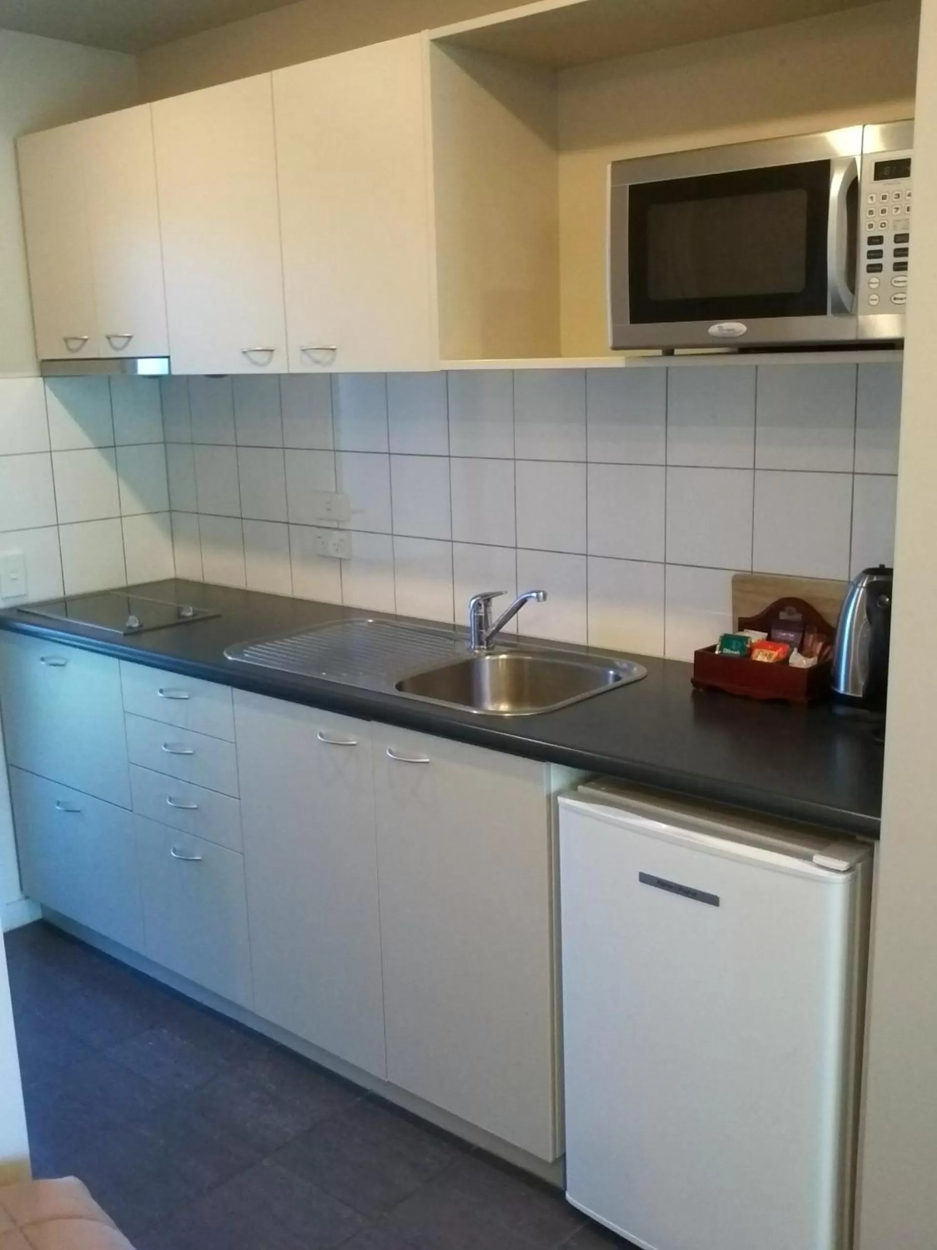 Kitchen or kitchenette in Azena Suites & Apartment
