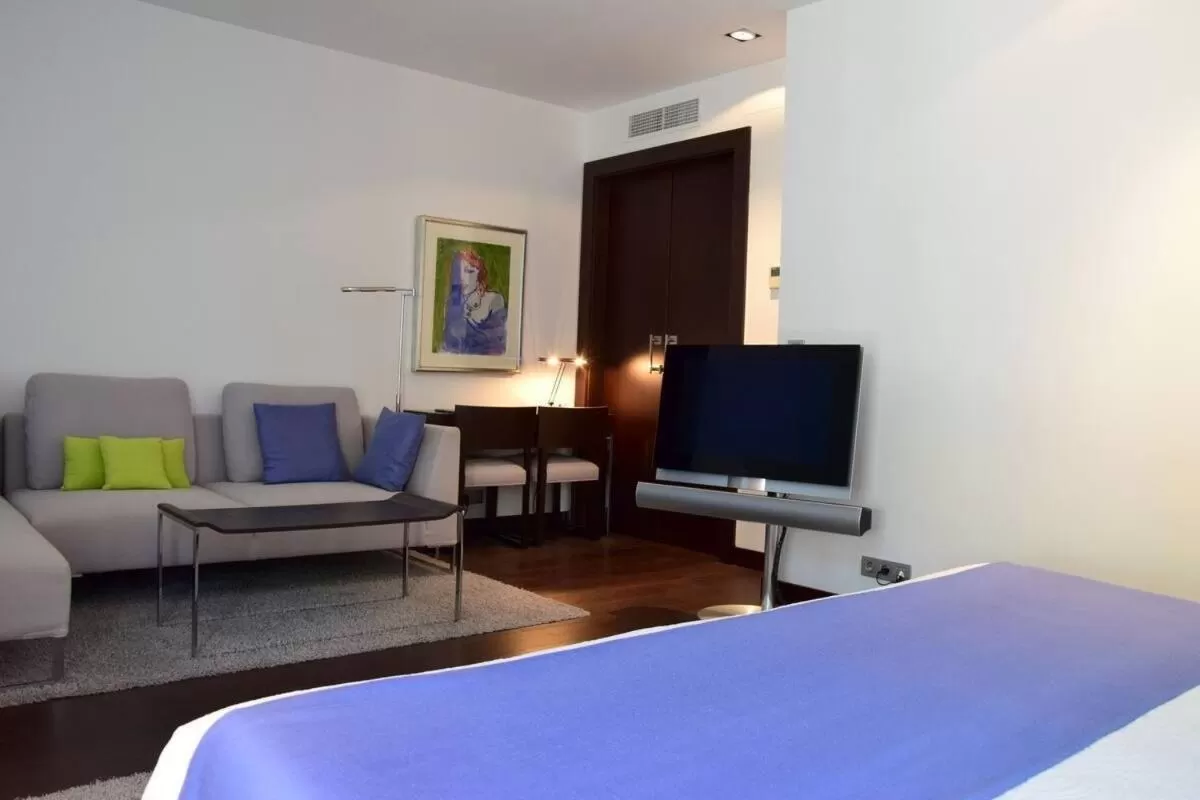 Bed, TV/Entertainment Center in Hotel Ferrero - Singular's Hotels