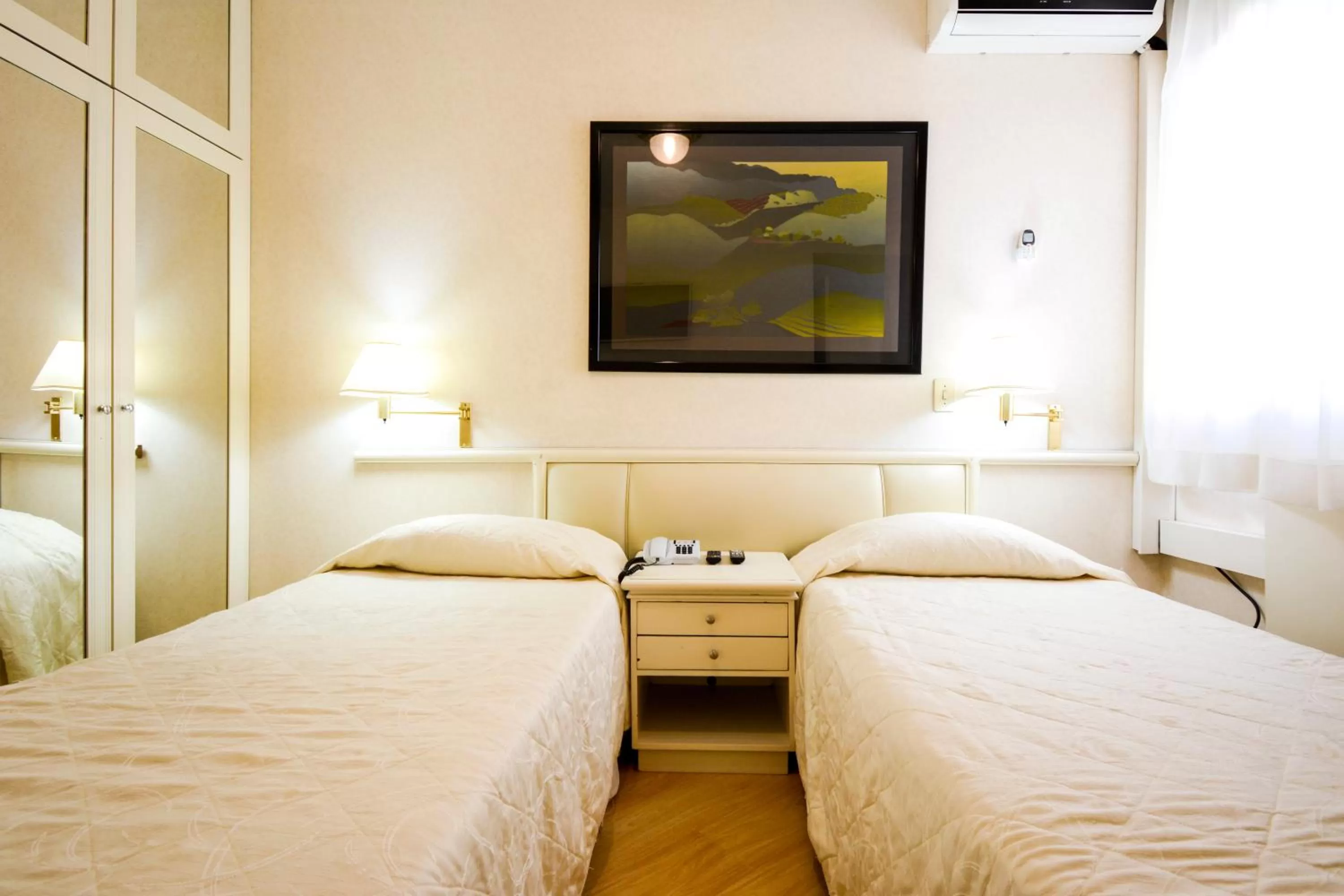 Bed in Wall Street Apartments by BnbHost