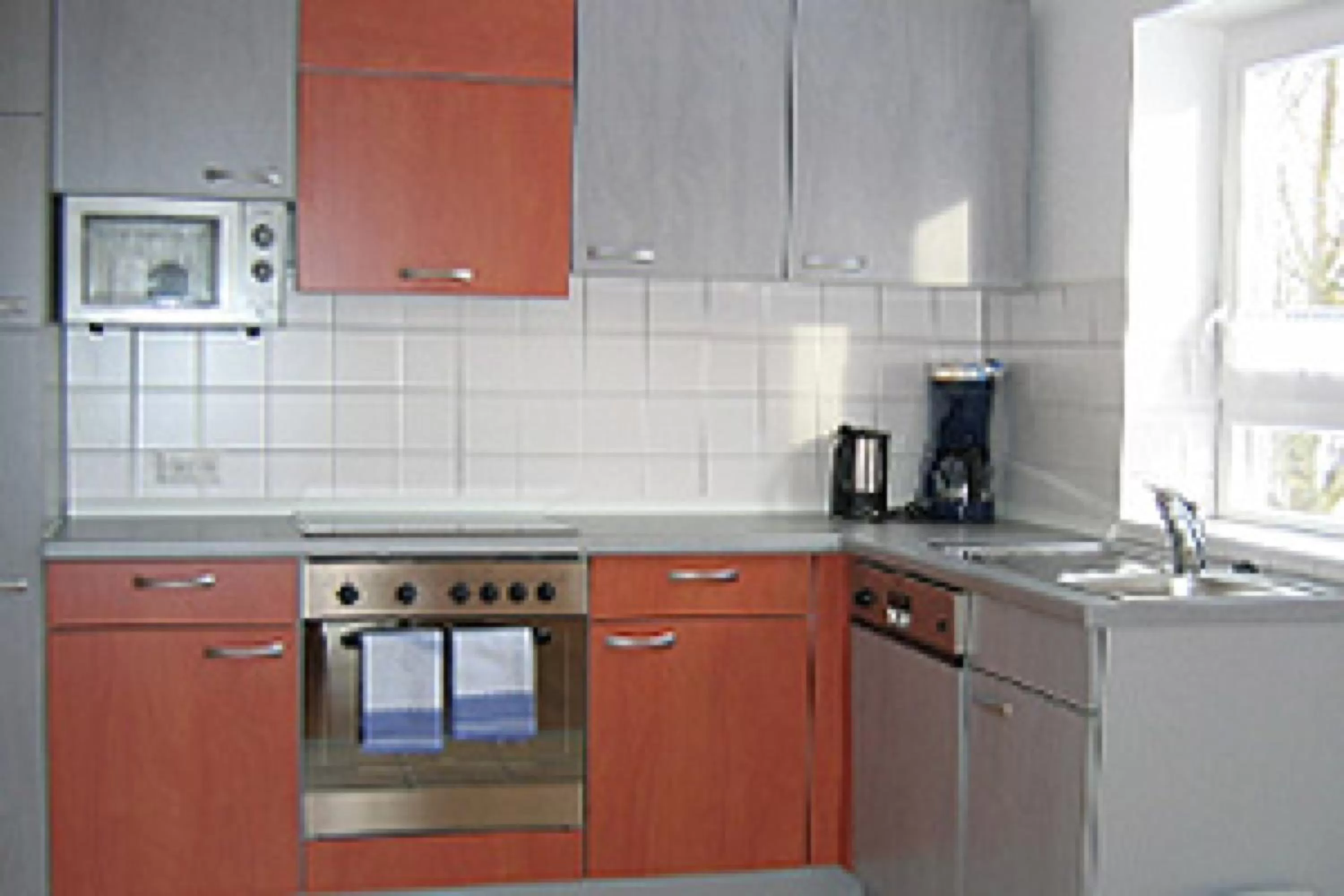 Kitchen or kitchenette in Gästehaus und Fewo Lamm Garni