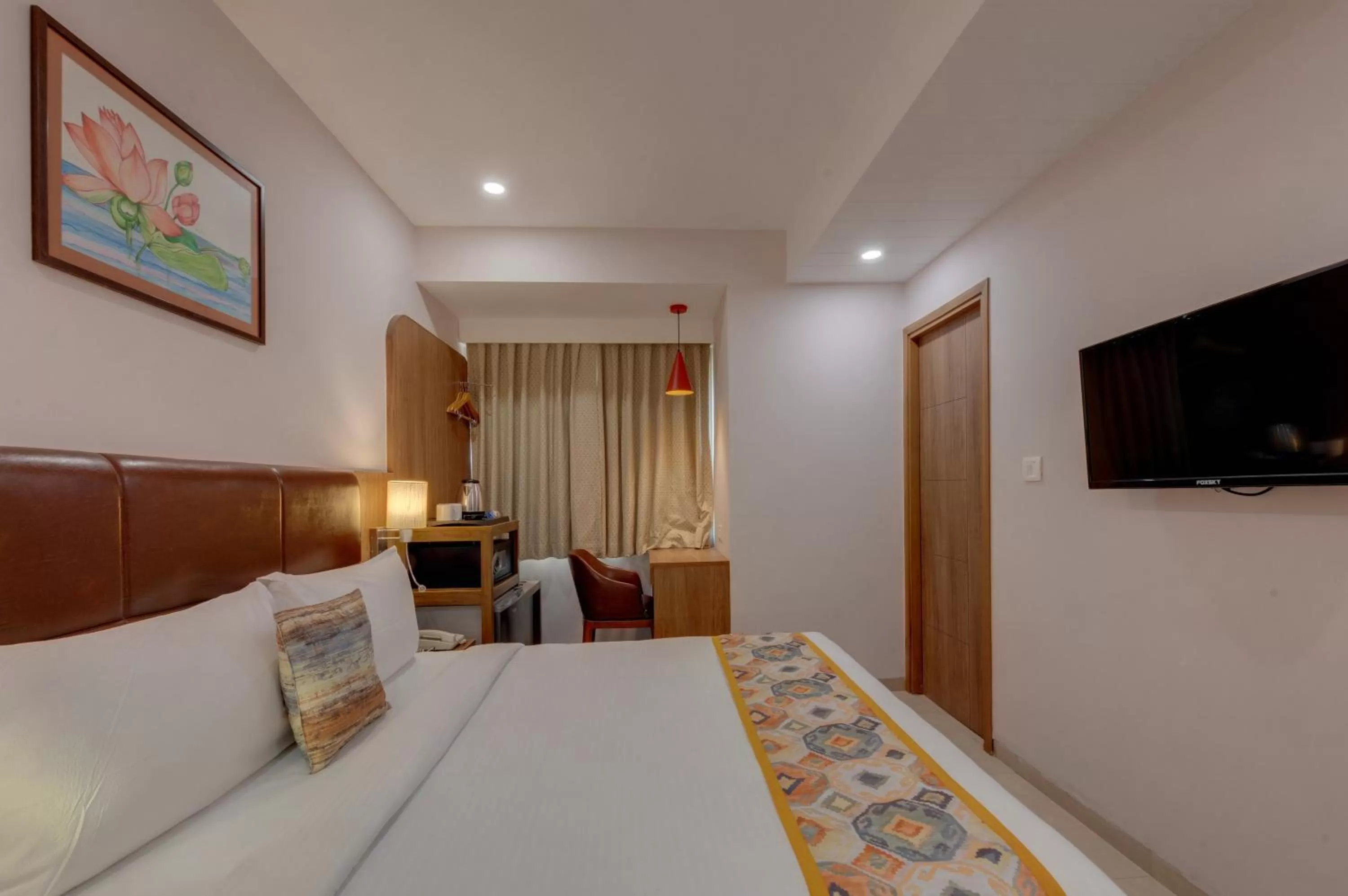 Bed in The Beacon Hotel Vadodara