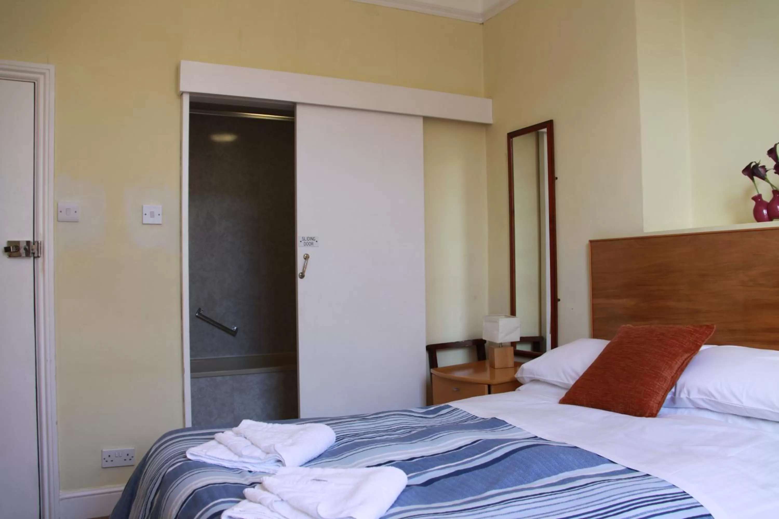 Bed in Ambassador Hotel