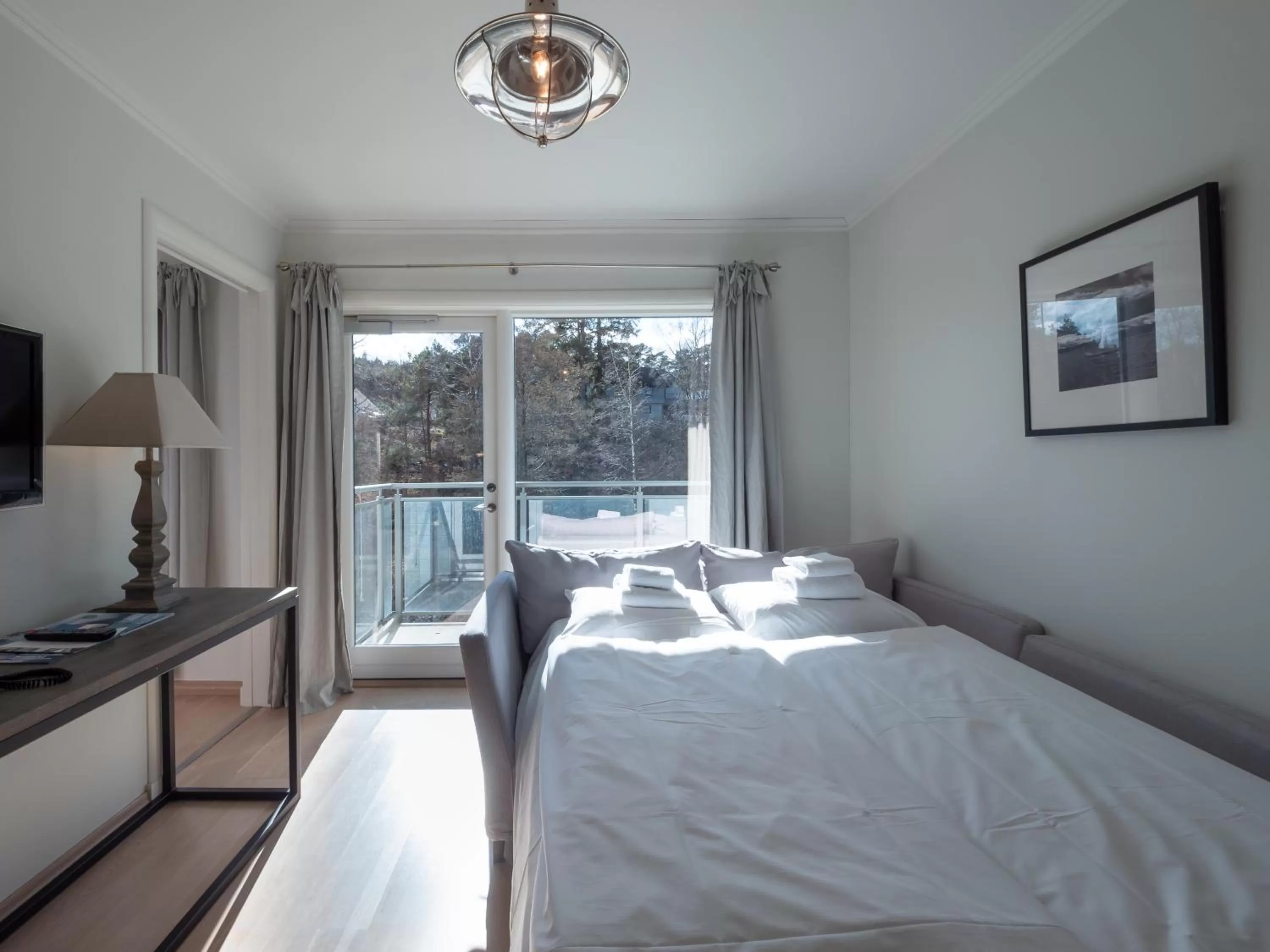 Living room, Bed in Strand Hotel Fevik - by Classic Norway Hotels