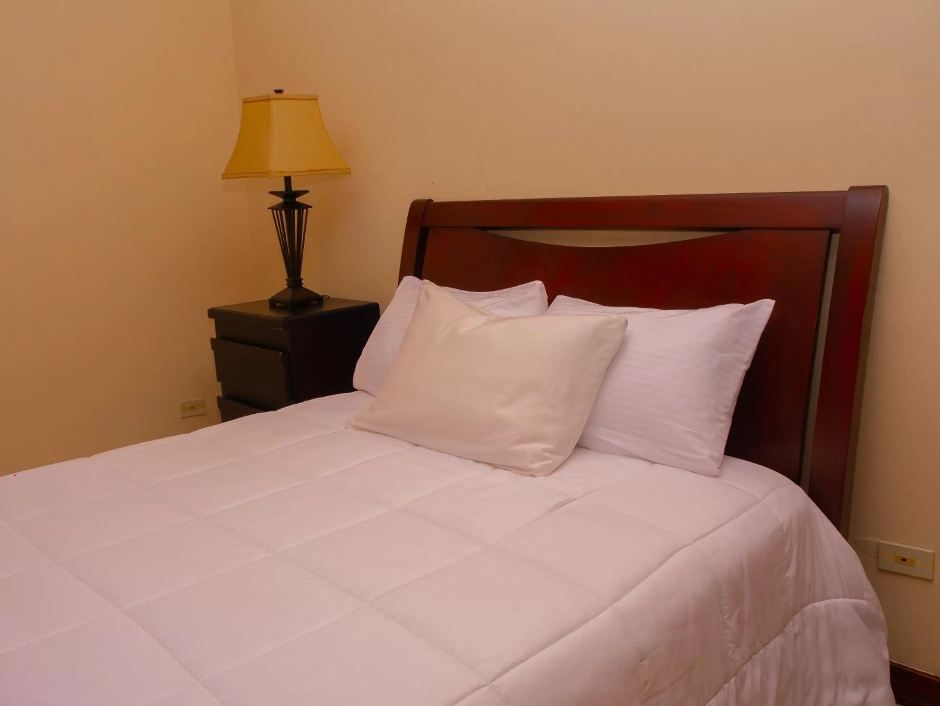 Bed in Hotel Bamboo Aeropuerto