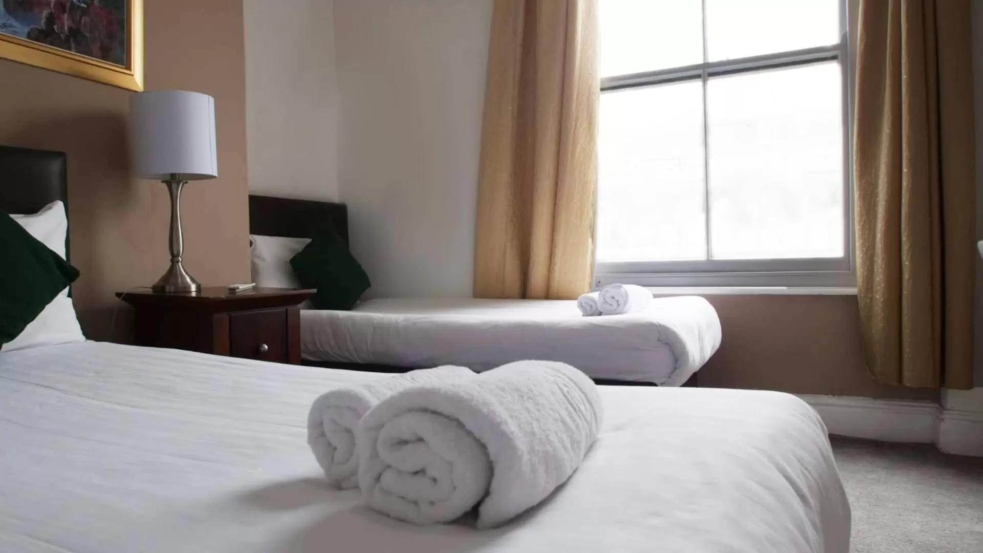 Bed in The Broadway Hotel