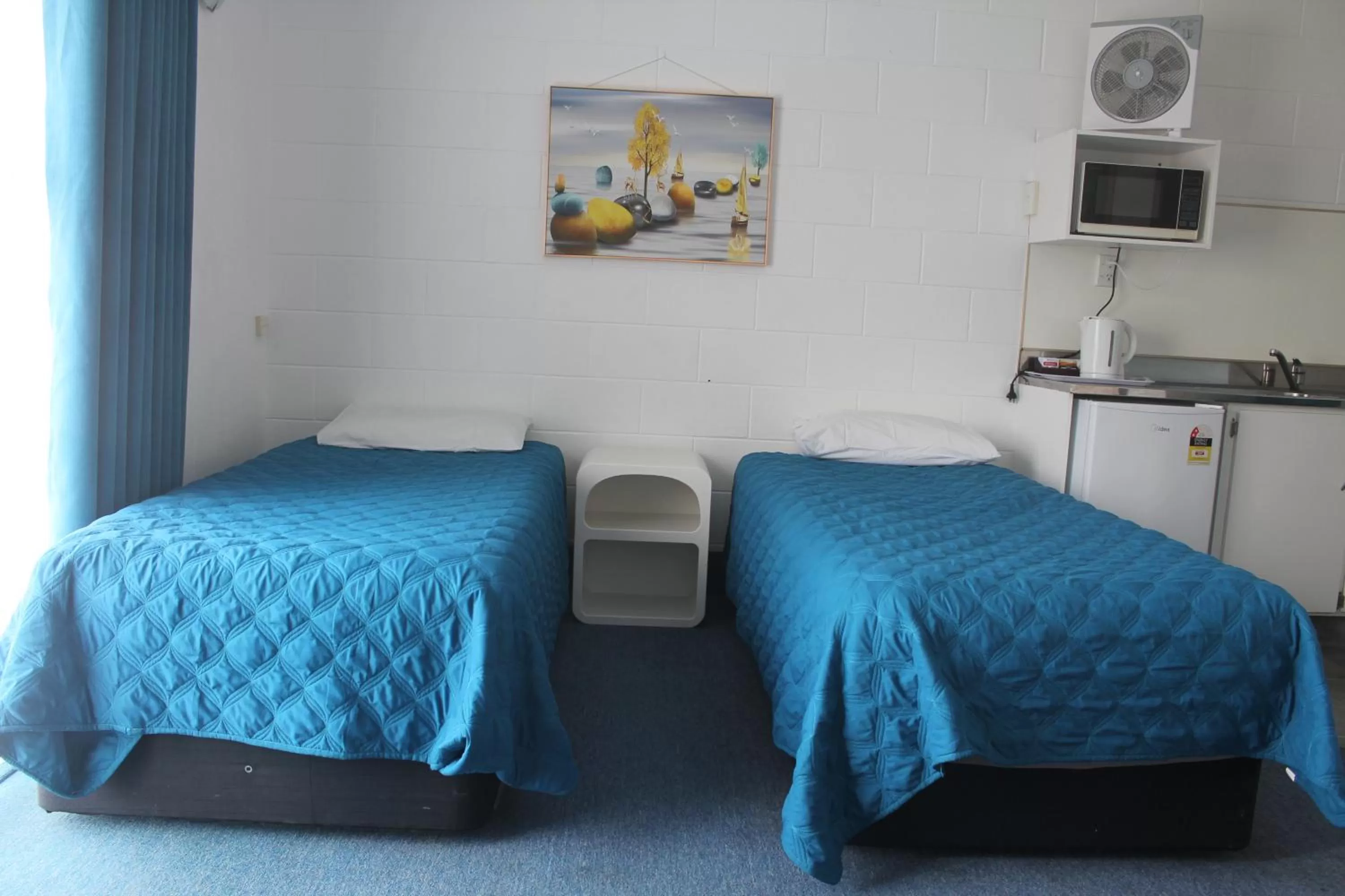 Bed in Golden Glow Motel