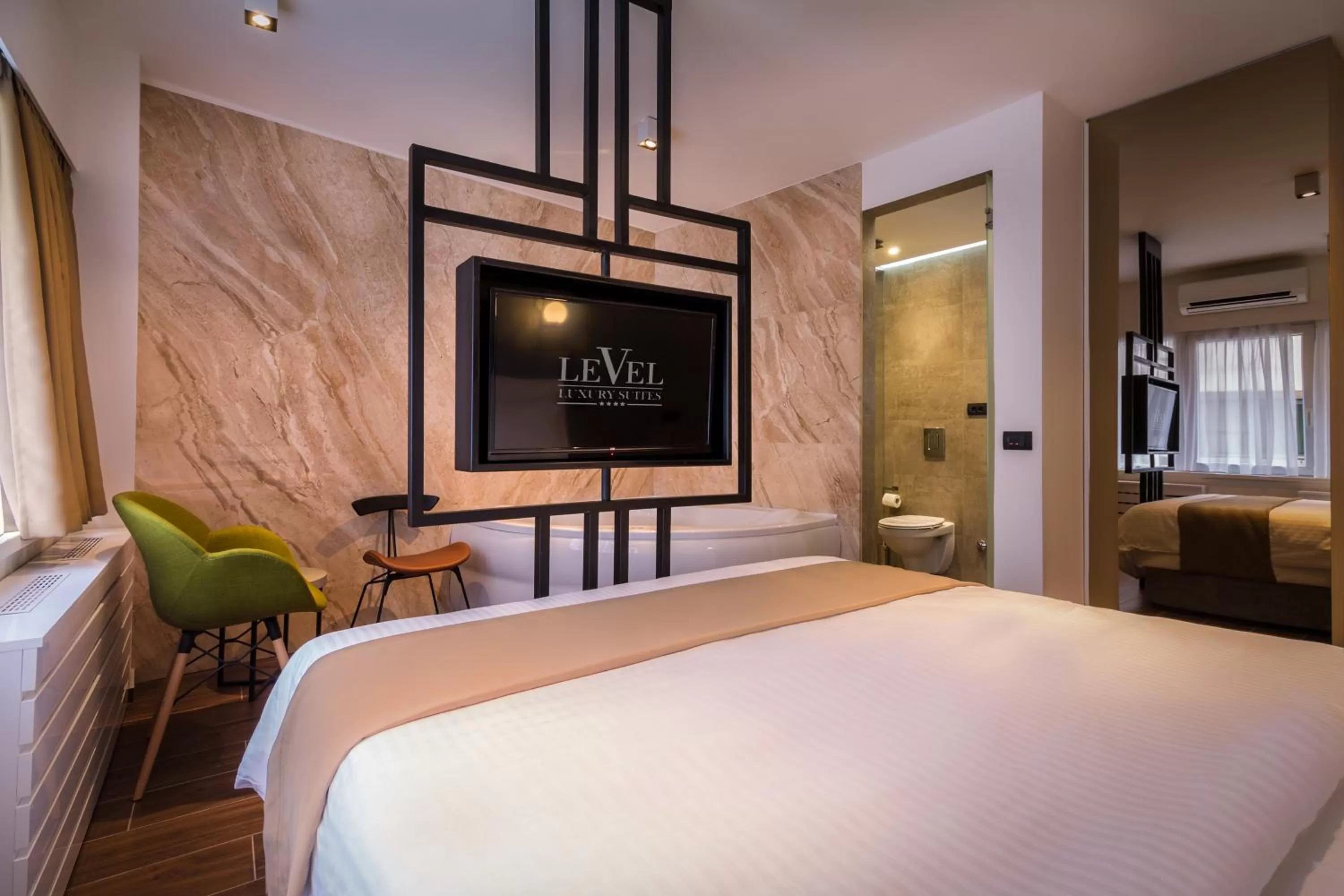 Bedroom, Bed in Level Luxury Suites