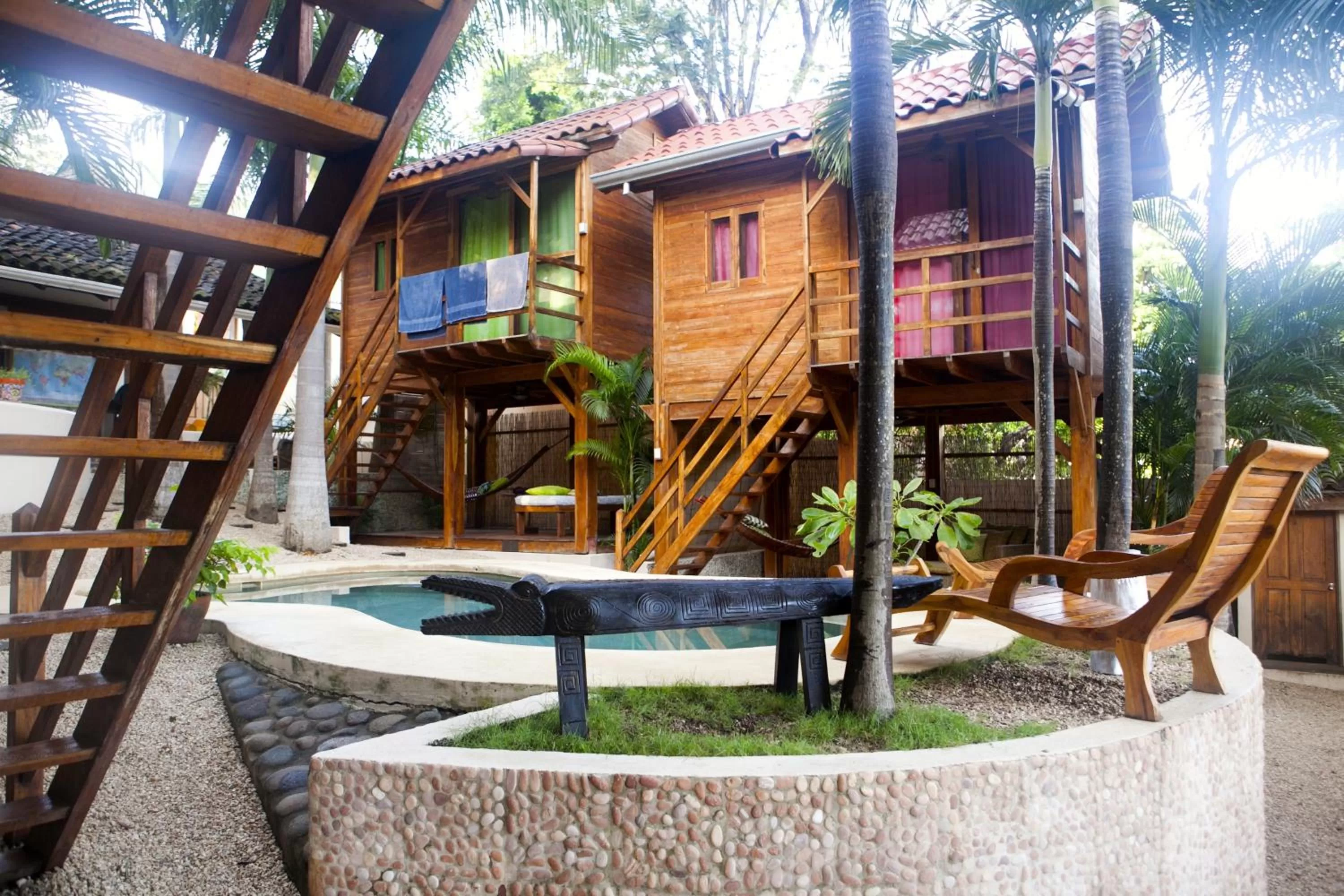 Swimming pool, Property Building in The Beach Bungalows - Yoga and Surf Hotel - Adults Only