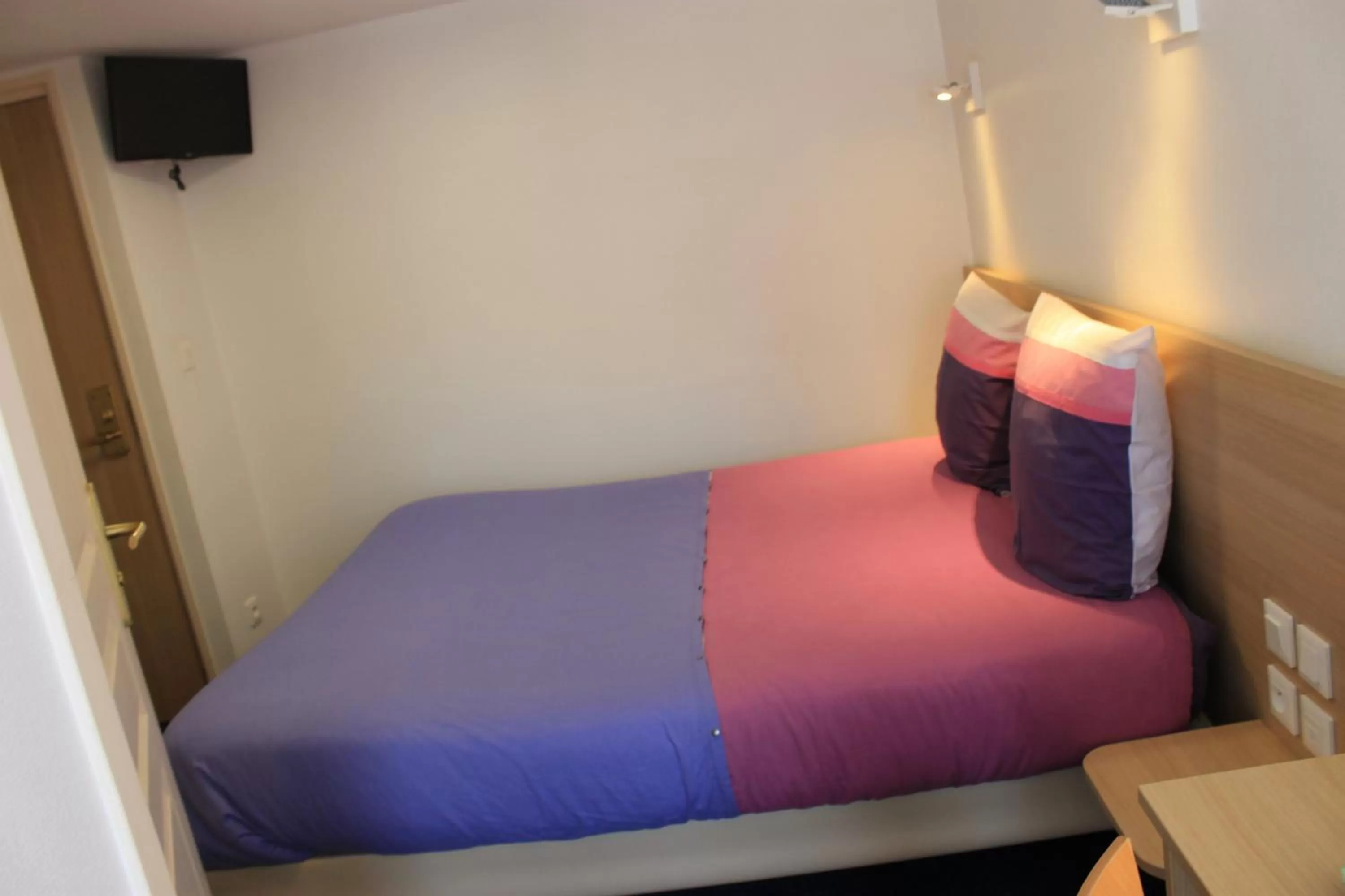 Bed in Hôtel du lion d'or