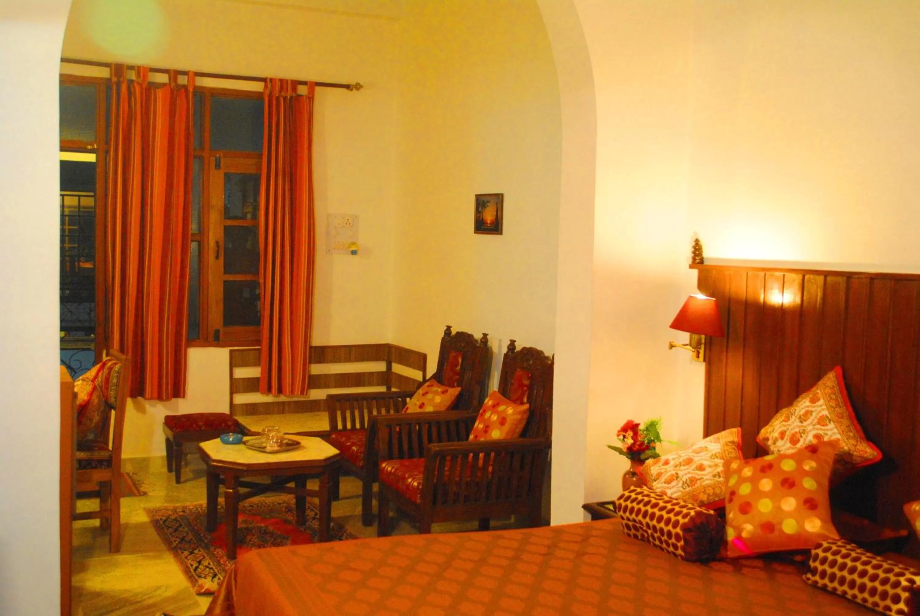 Seating area, Bed in Hotel Harmony