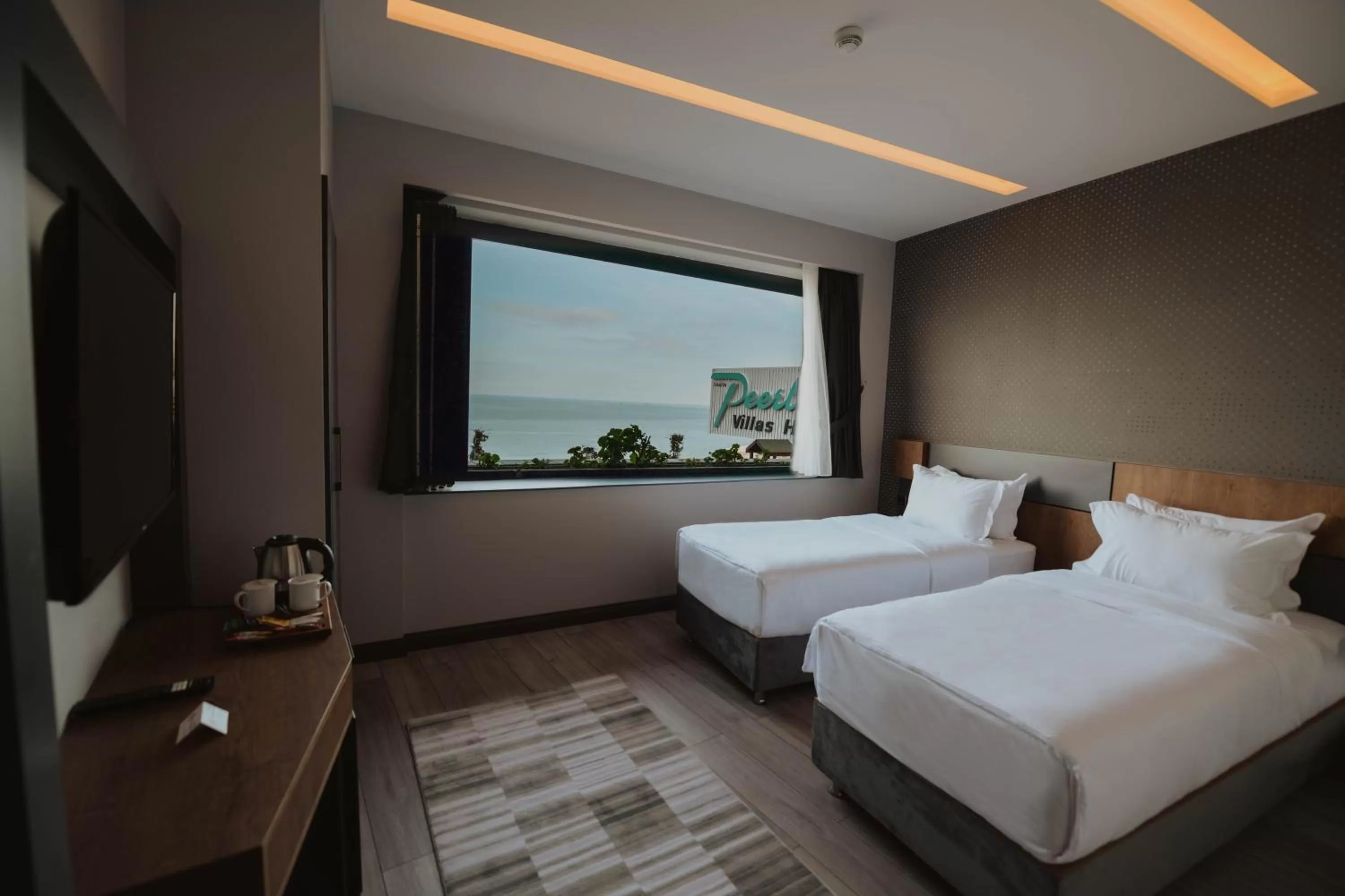 Bed in Peerless Villas Hotel