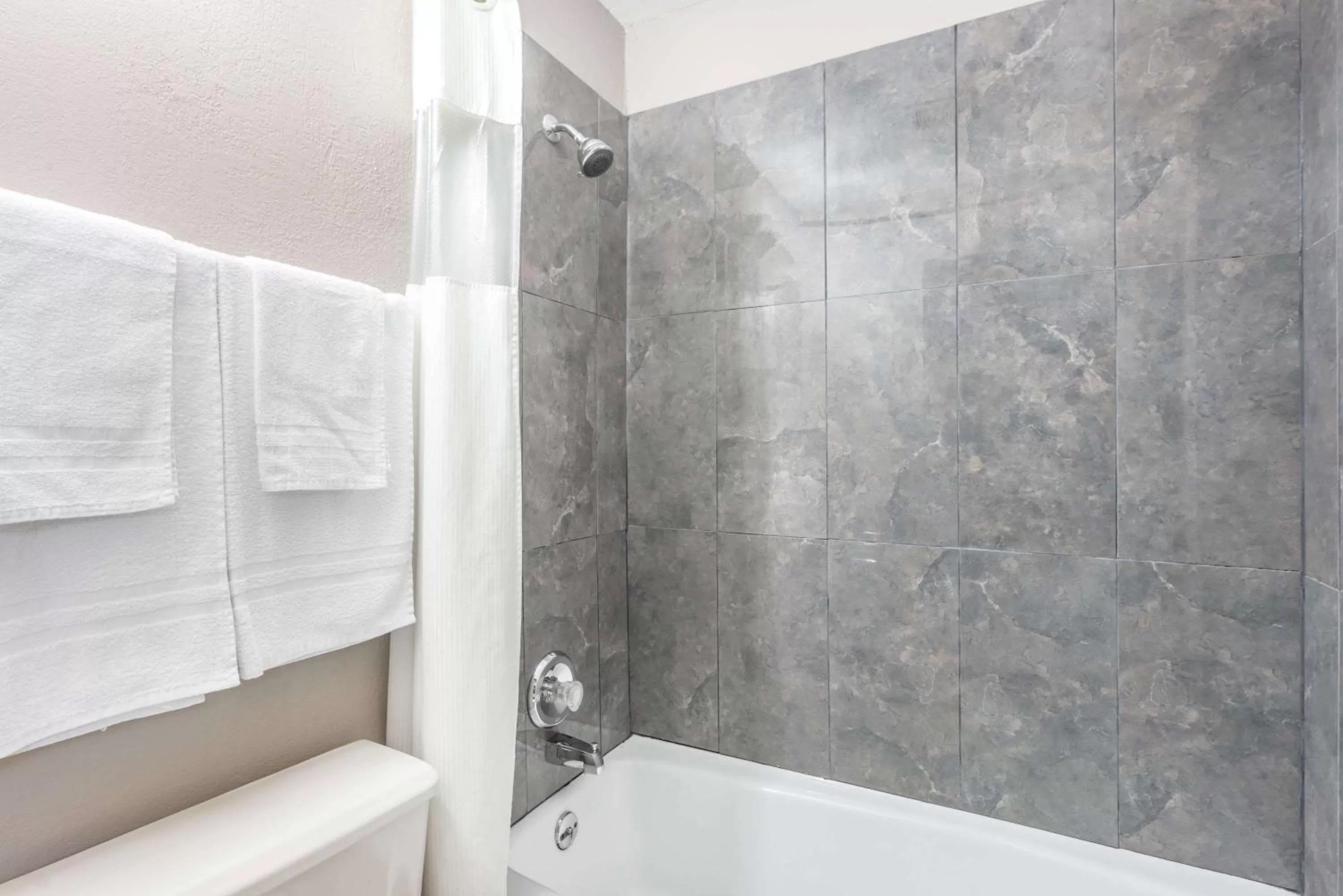 Bathroom in Super 8 by Wyndham O'Fallon MO/St. Louis Area