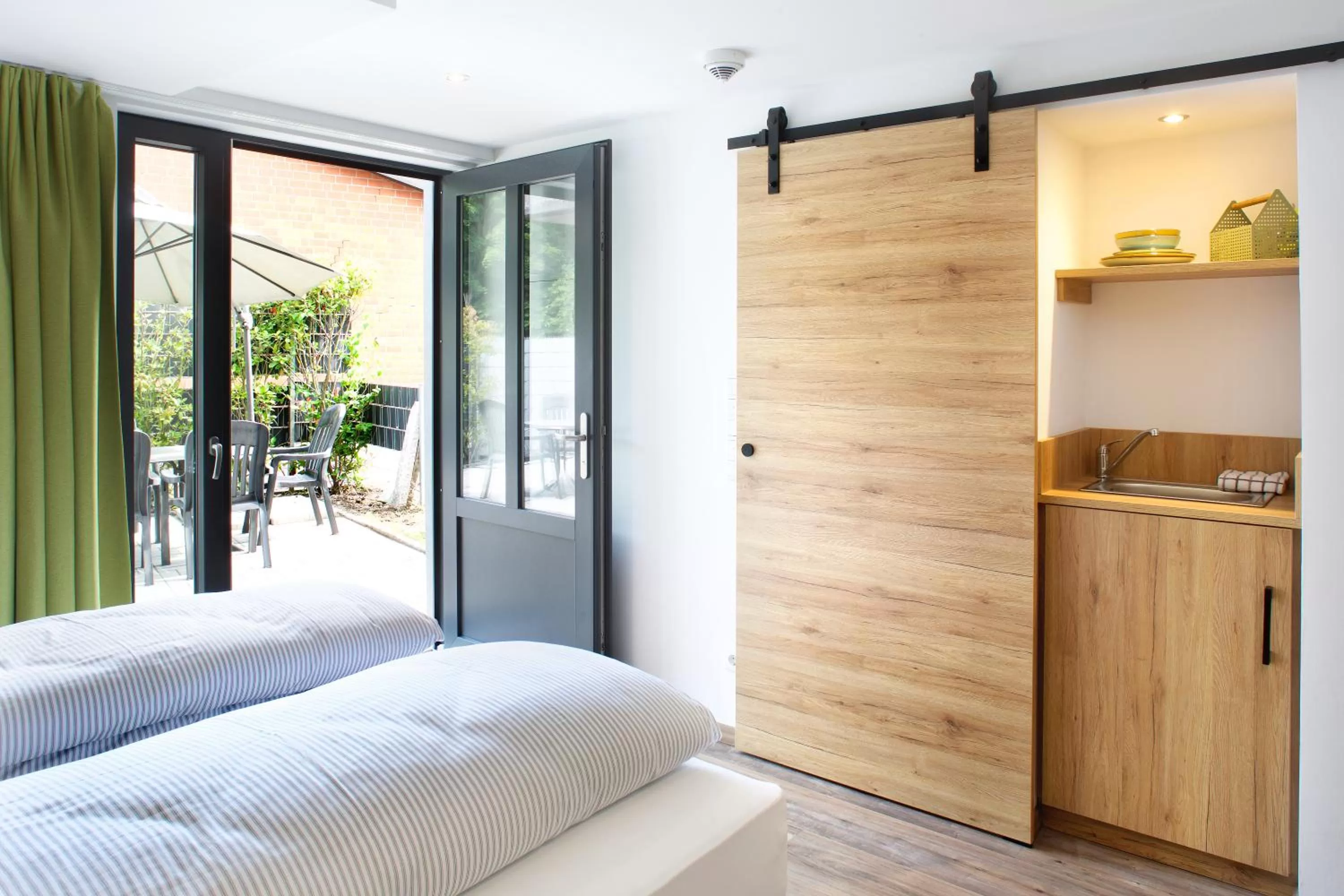 Photo of the whole room, Bed in OlfenLodge