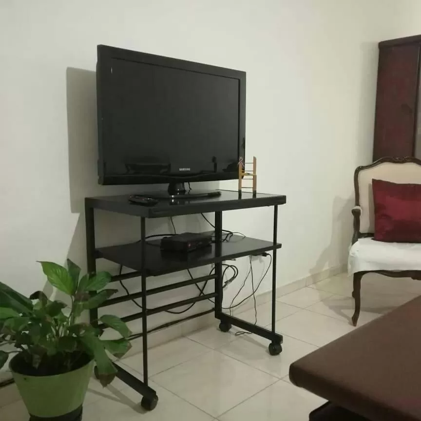 Communal lounge/ TV room in Posada Dilia del Alba