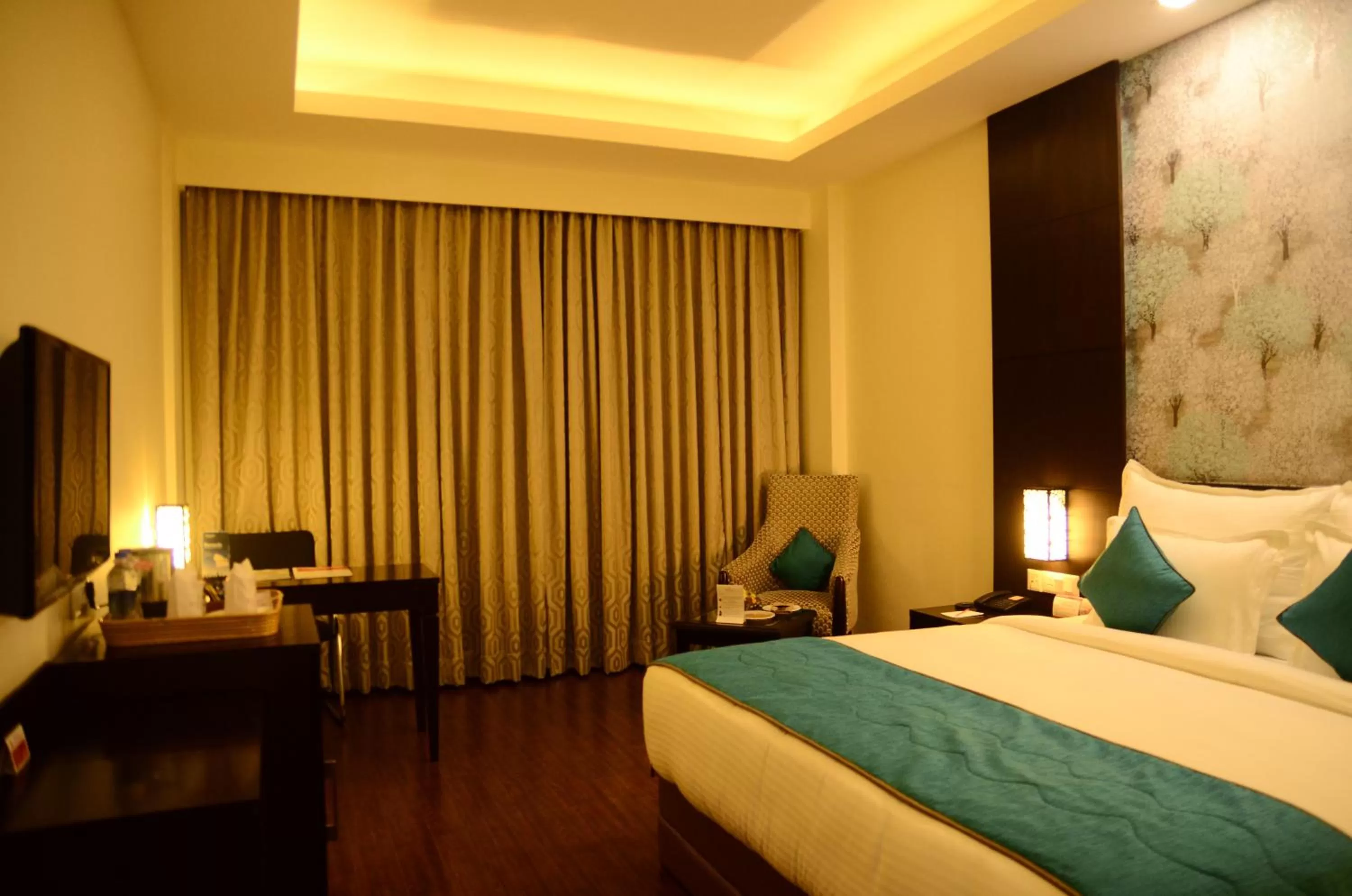 Living room, Bed in Ramada Jamshedpur Bistupur