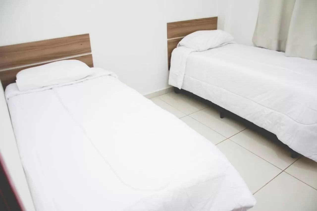 Bed in Leati's Hotel