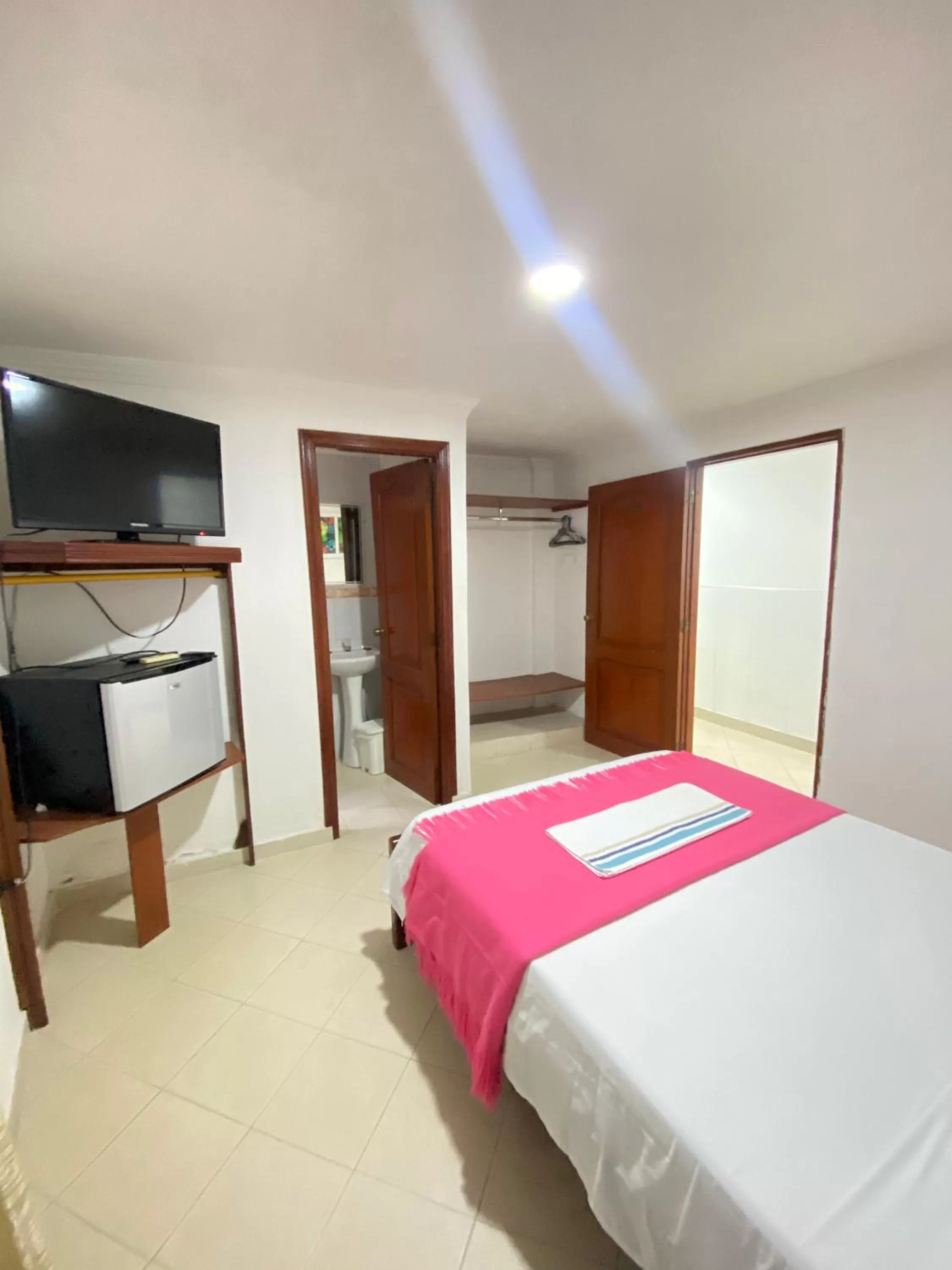 Communal lounge/ TV room, Bed in Hotel La Guajira