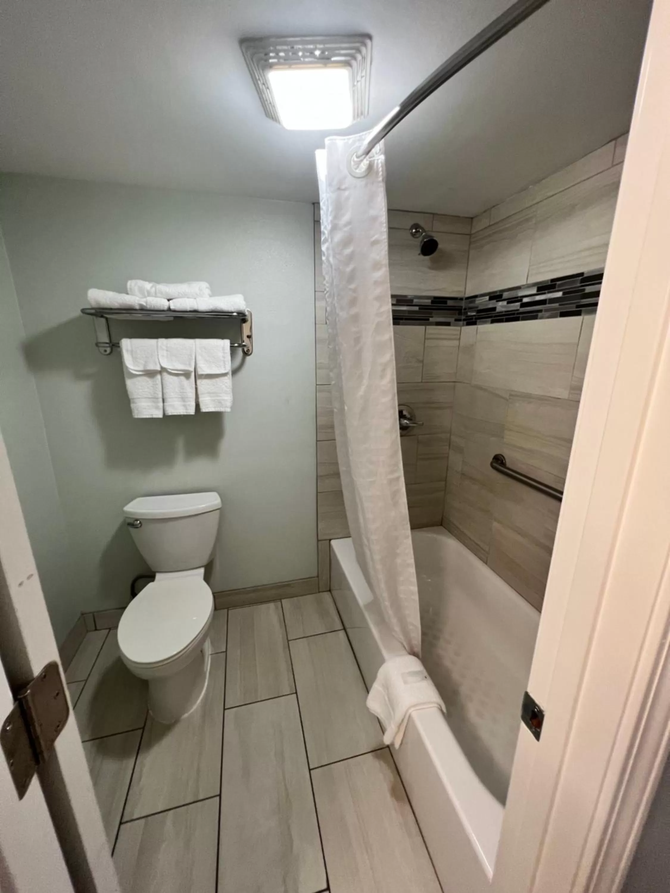 Shower in Continental Inn and Suites Nacogdoches TX SFA University Downtown