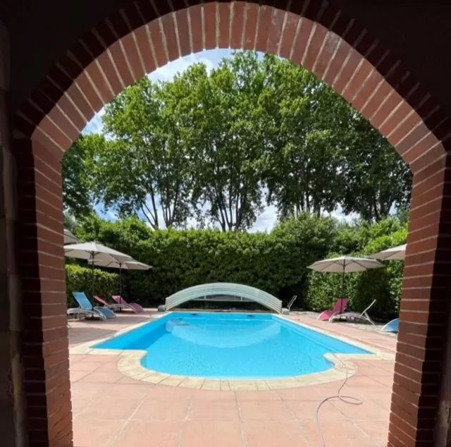 Swimming pool in Logis Hotel Restaurant Le Domaine de la Régalière
