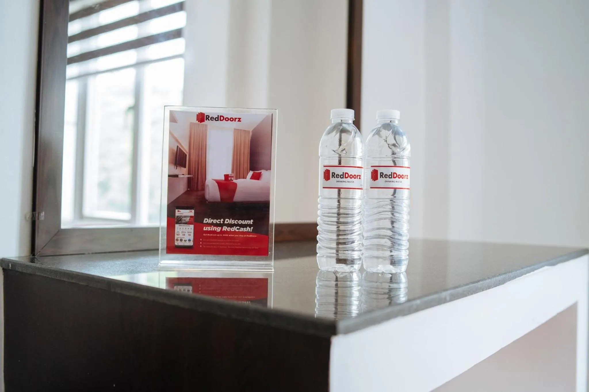 Drinks in RedDoorz Plus at One Liberty Hotel Kalayaan Avenue