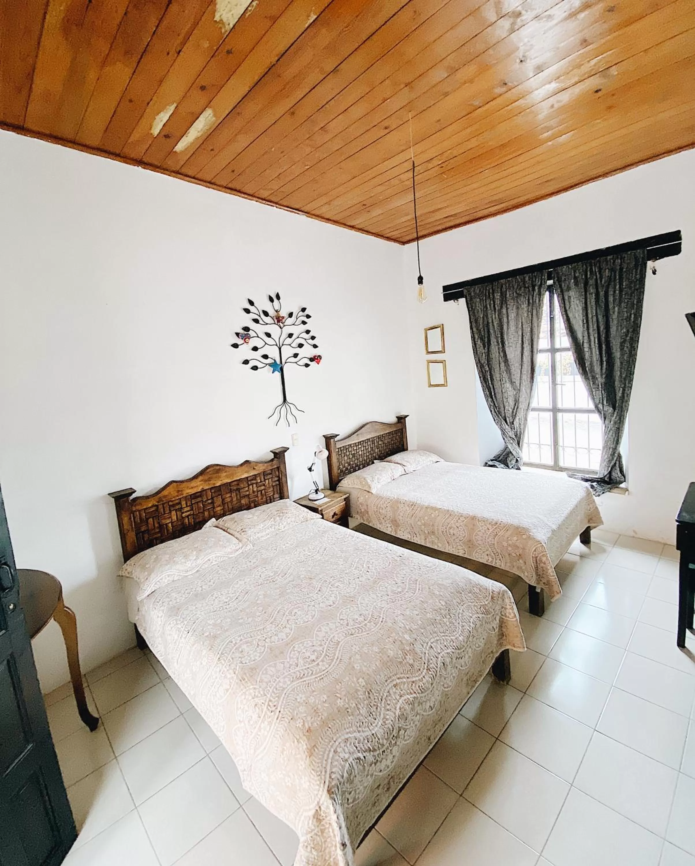 Photo of the whole room, Bed in El Naranjo Hotel Finca Urbana